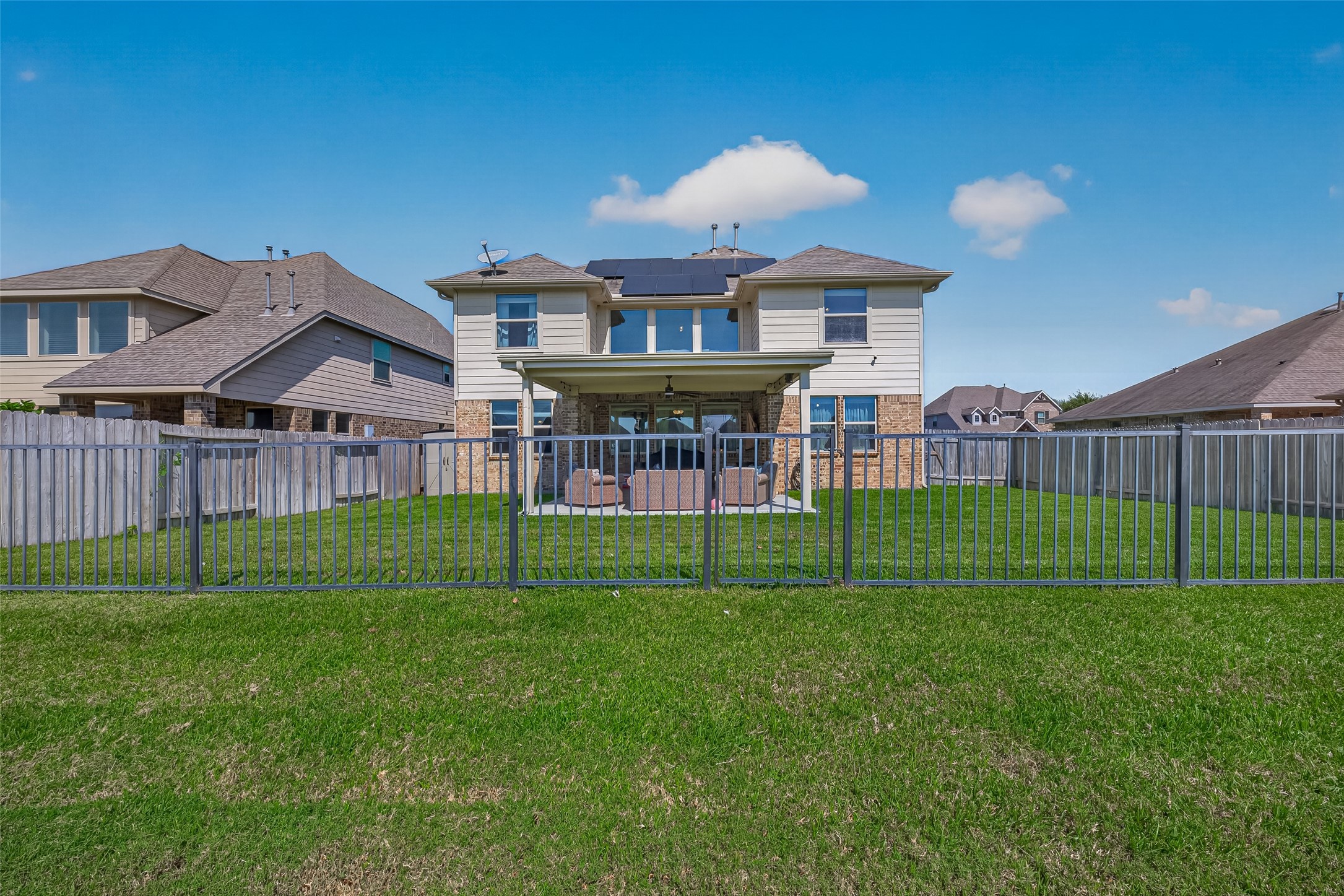 A view from the park behind the home highlights its backyard setting in Kingdom Heights, Rosenberg.