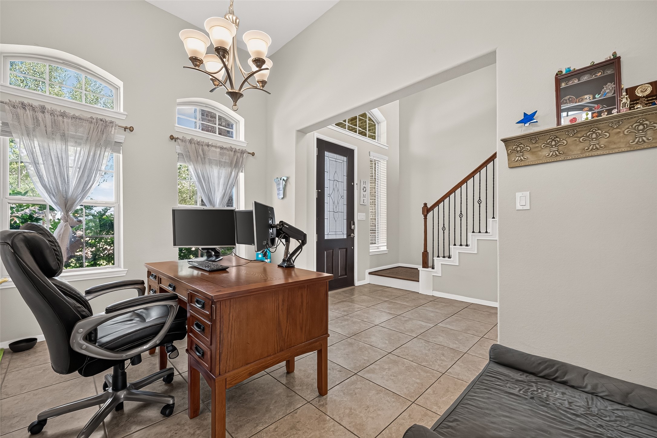 Large windows brighten this flexible workspace near the front entrance.