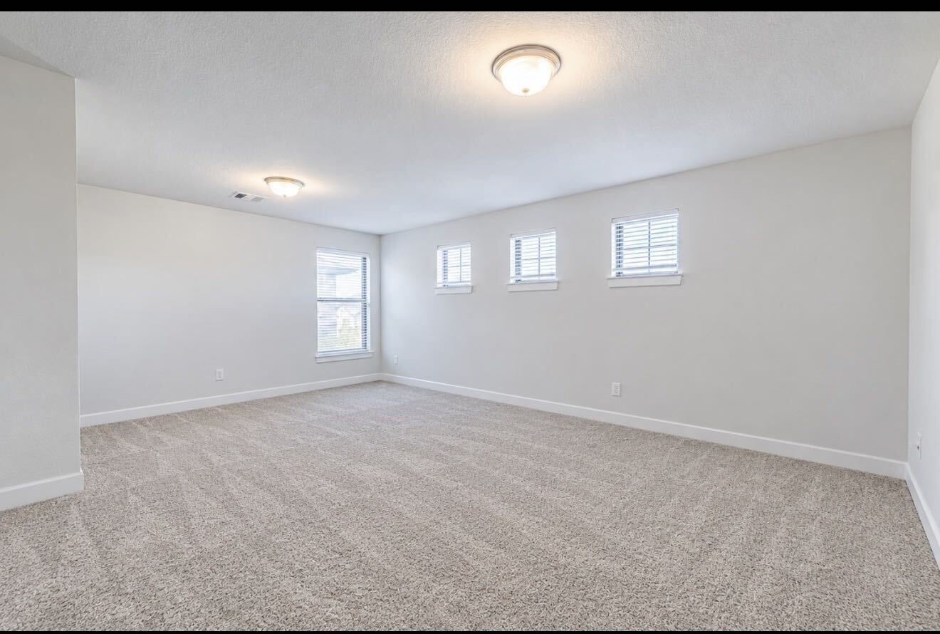 Another view of the spacious game room upstairs.