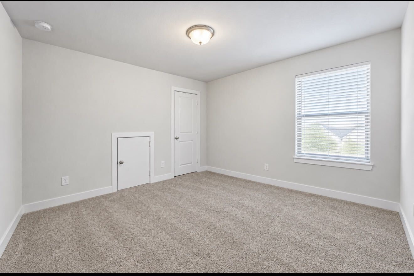Comfortable and versatile secondary bedroom.