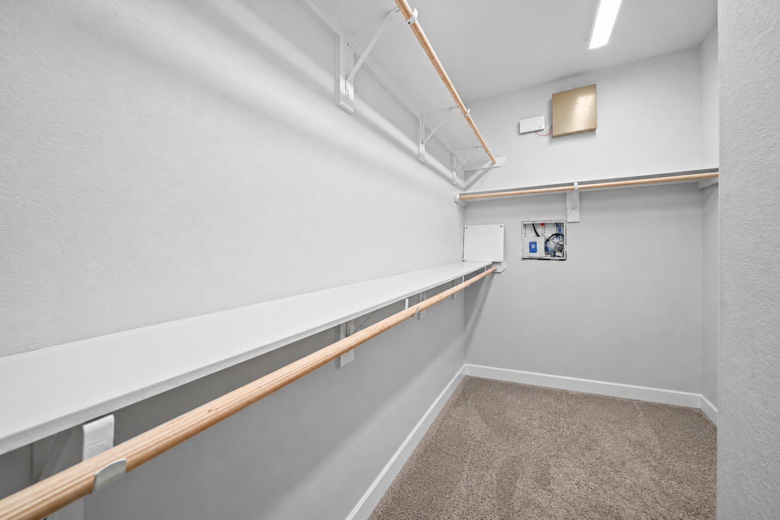 A walk-in closet with space to spare, making it easy to keep clothes, shoes, and extras neatly put away. A walk-in closet with space to spare, making it easy to keep clothes, shoes, and extras neatly put away.