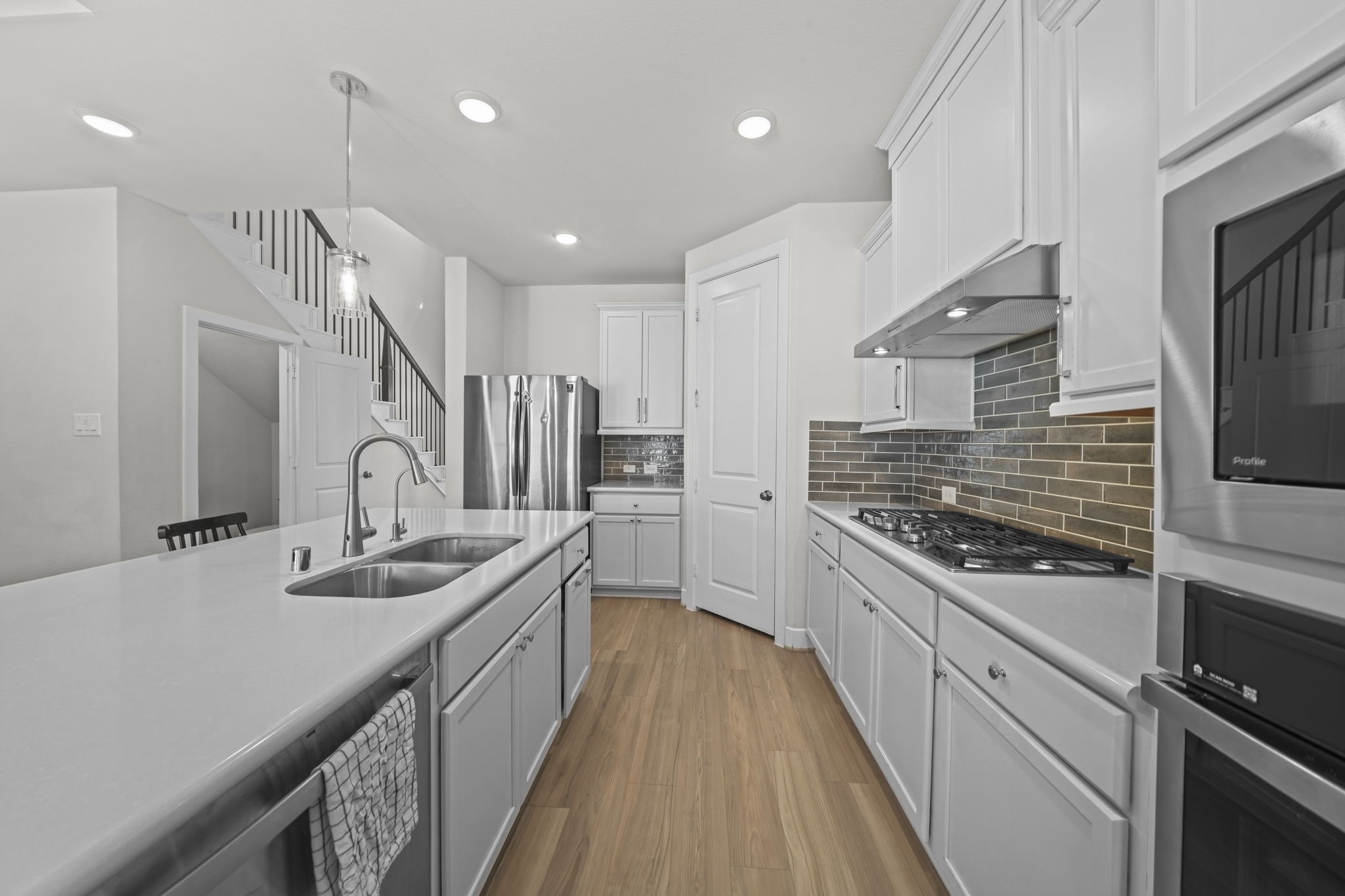 Smart layout with a gas cooktop, wall oven, and plenty of counter space, so everyday meals come together with ease. Smart layout with a gas cooktop, wall oven, and plenty of counter space, so everyday meals come together with ease.