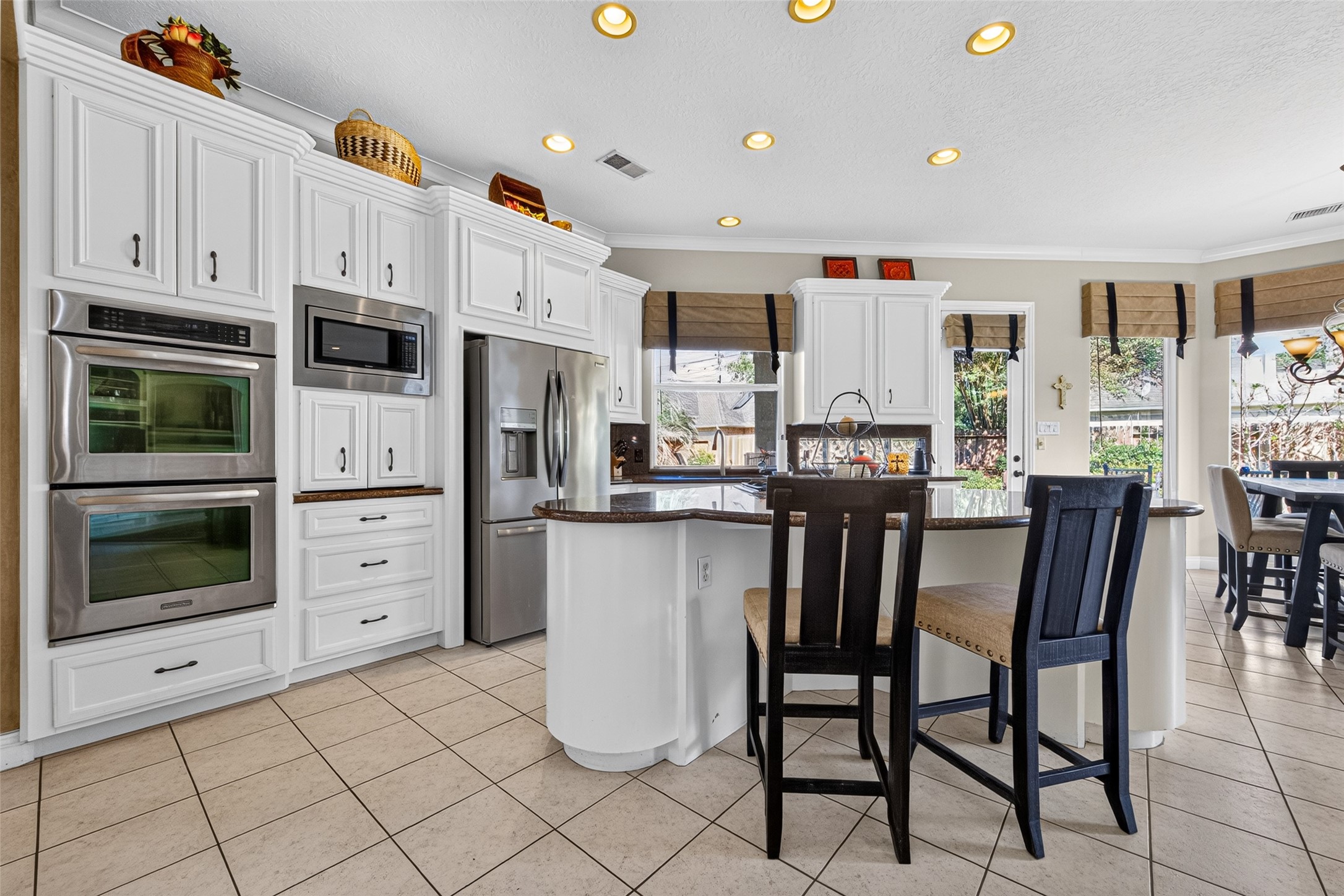 The large island makes the kitchen the heart of the home.  Prepare meals, dine or entertain...the choice is yours!