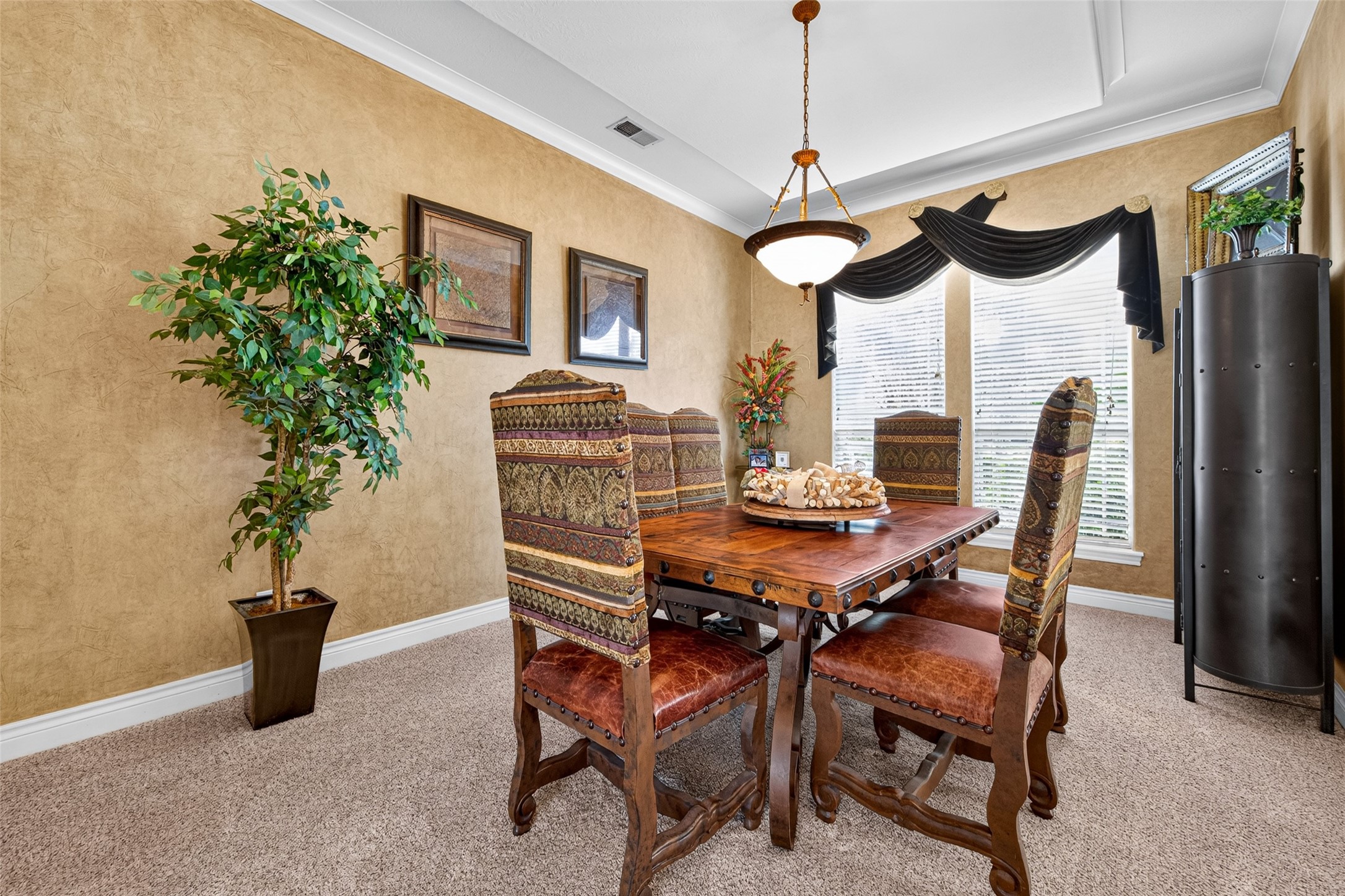 The formal dining room is ideal for gatherings large or small, formal or informal