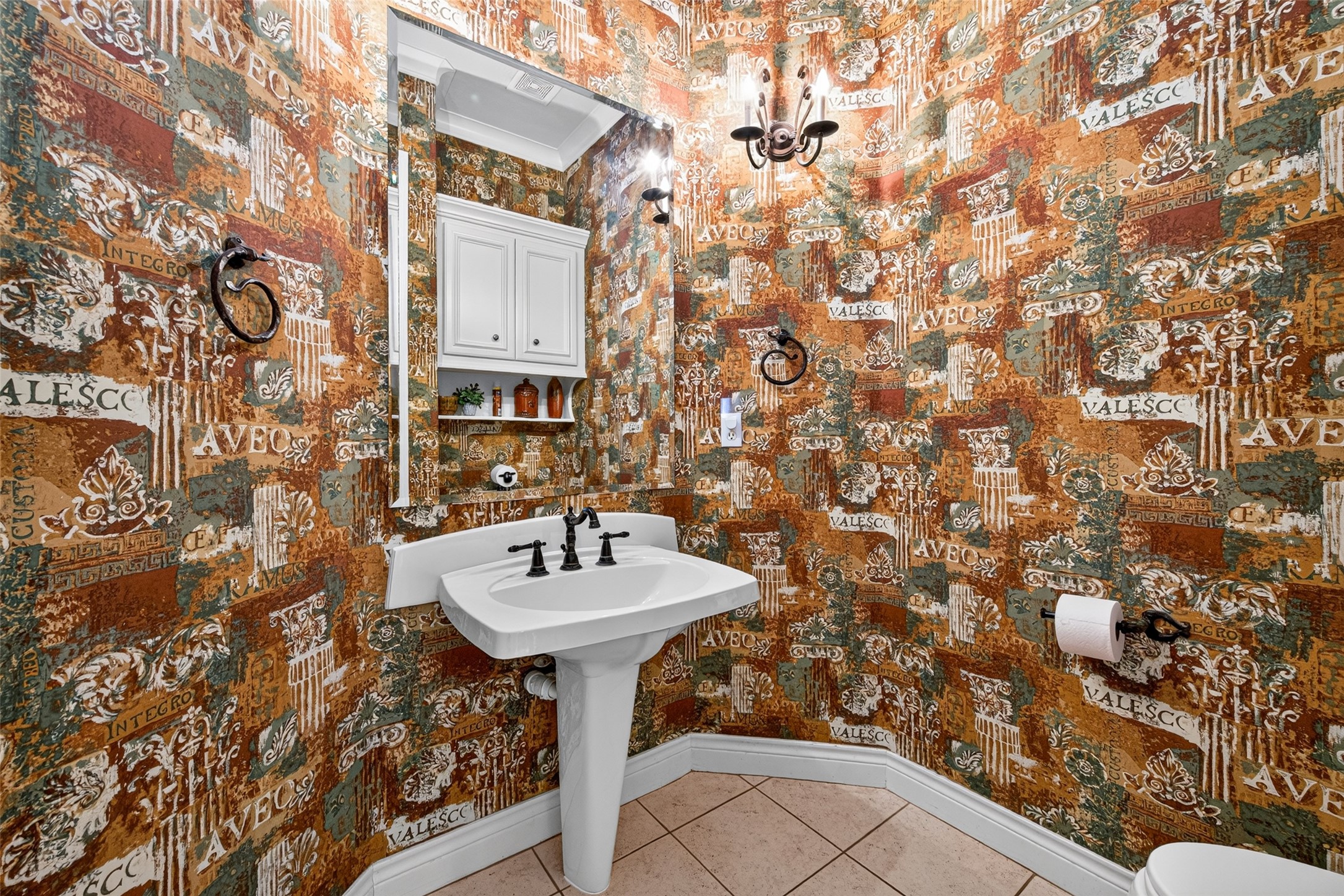 Half-bath is downstairs off the kitchen and formal dining room