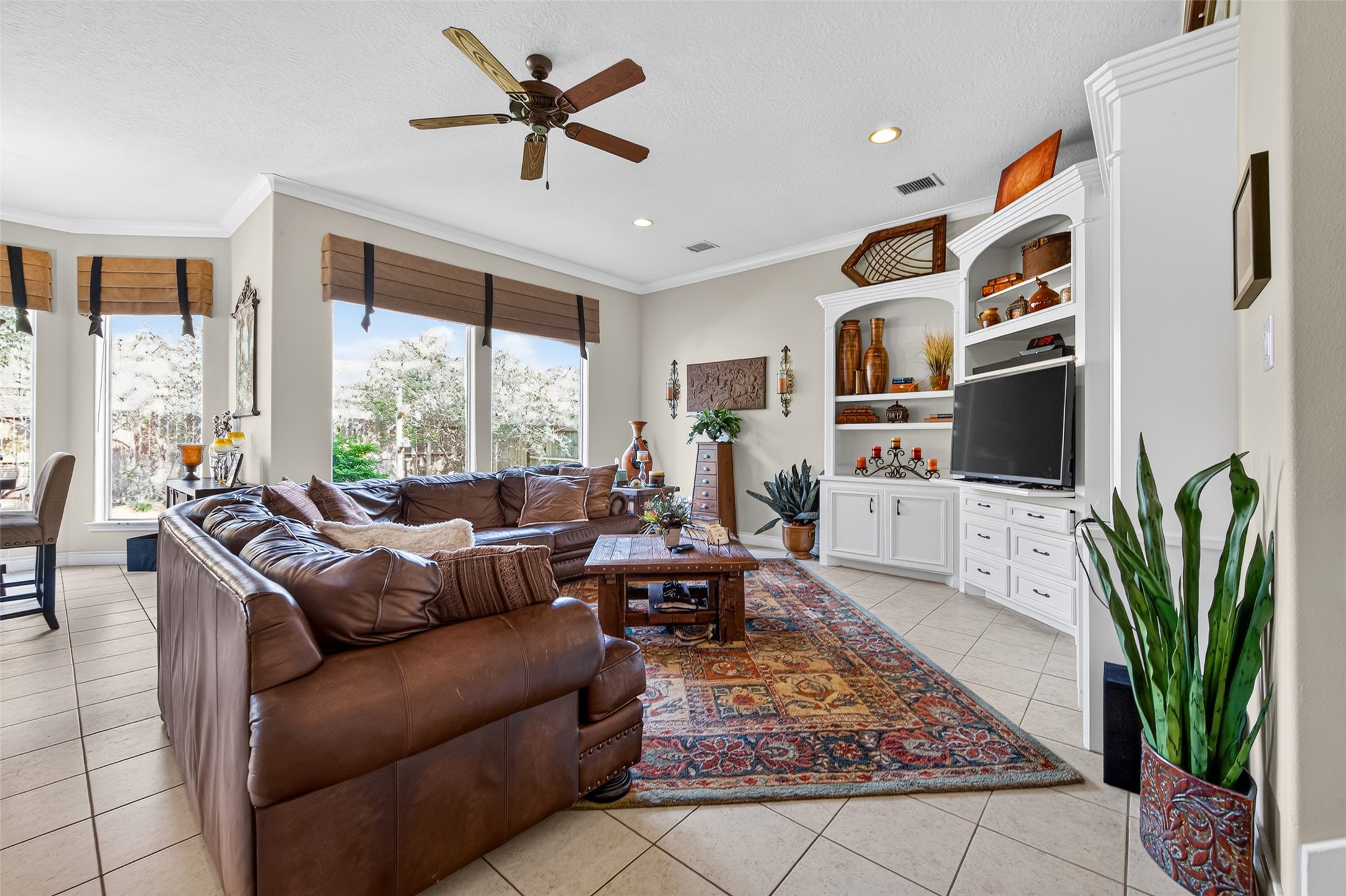 The downstairs den features plenty of built-in storage, an abundance of natural light and is ideal for entertaining or relaxing in the evenings.