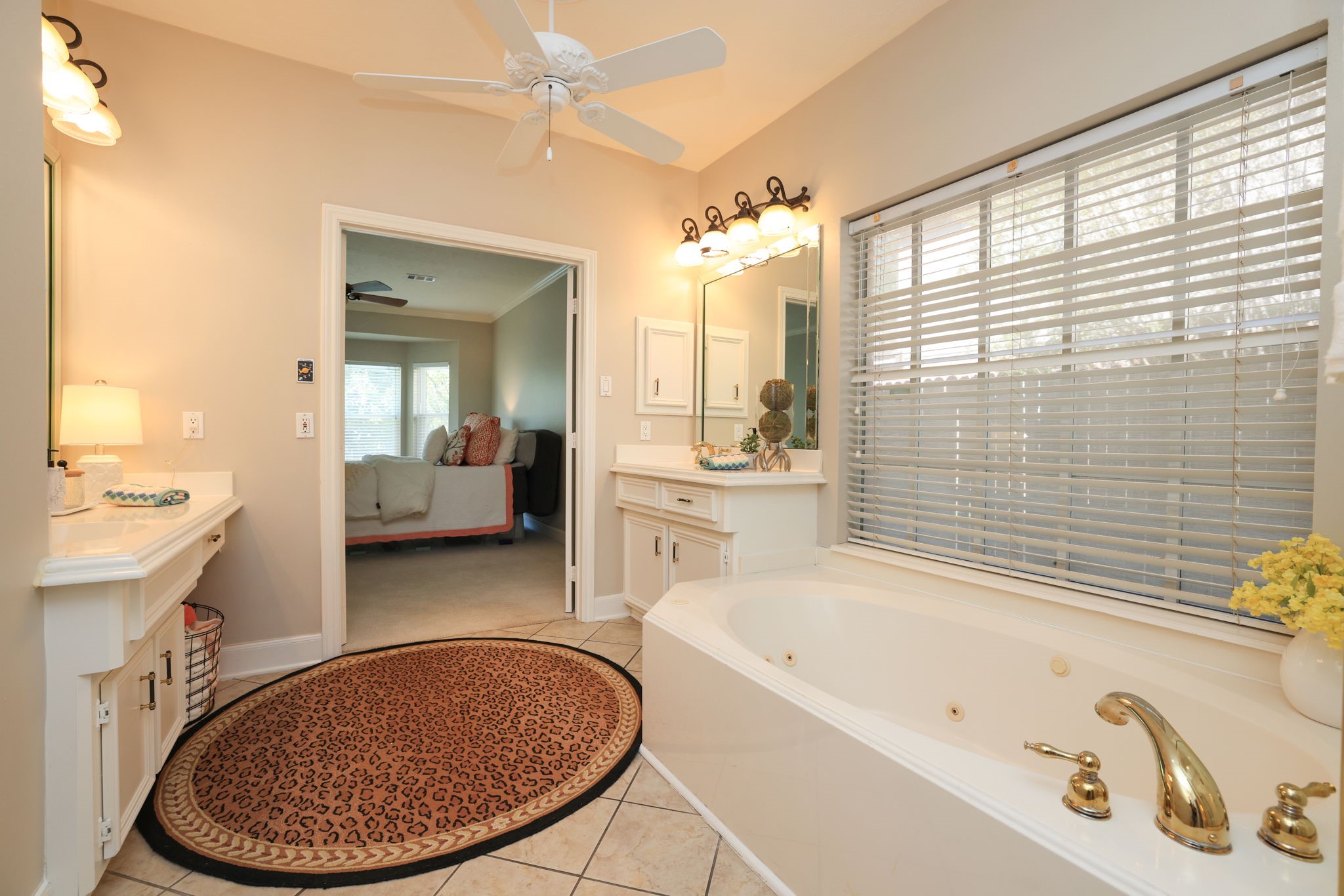 Relaxing ensuite bath with abundant natural light and easy flow back into the primary suite.