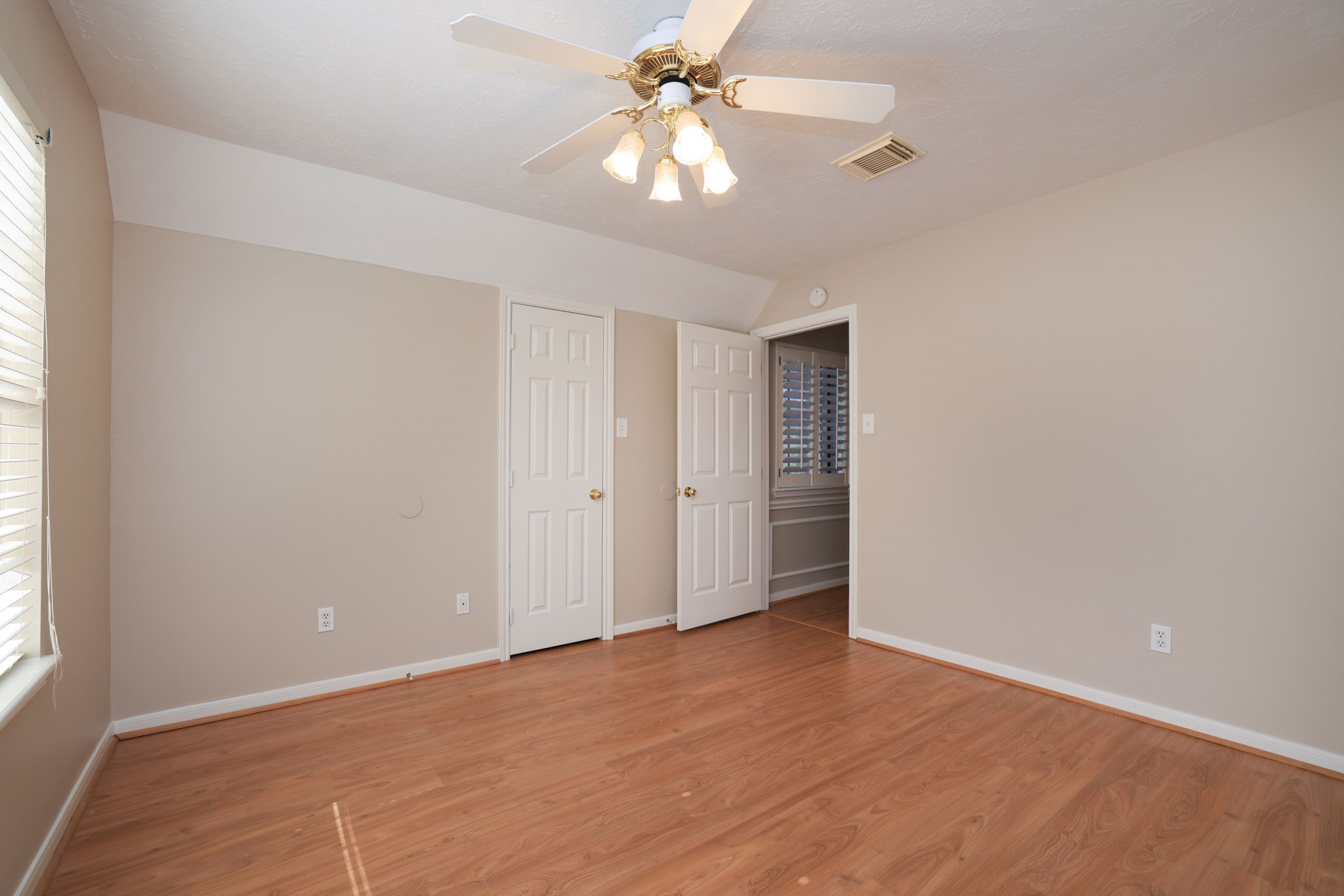 Alternate View with Neutral tones and warm flooring create a cozy retreat for family or guests.