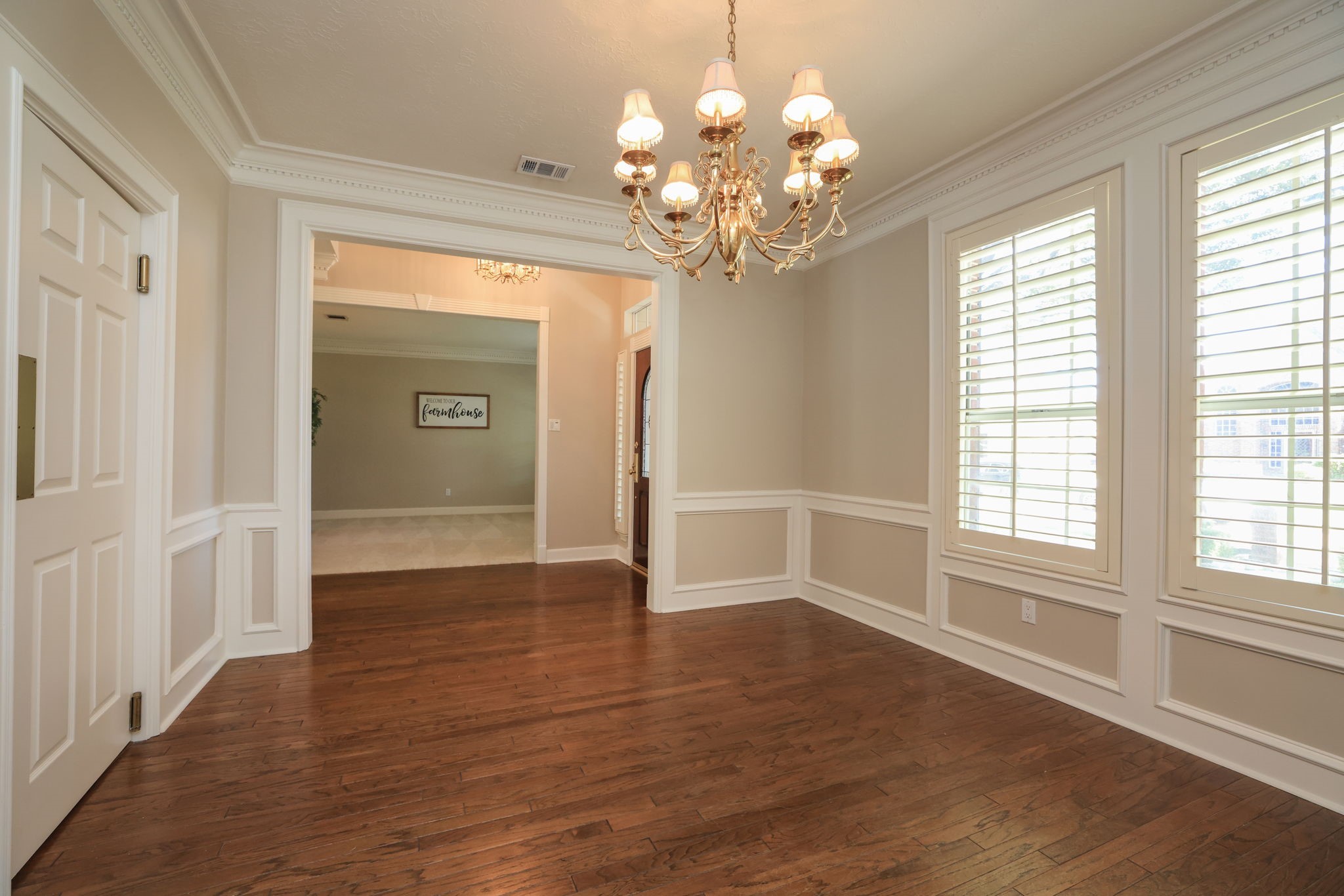 Spacious dining area just off the foyerperfect for gatherings and showcasing beautiful trim and natural light.