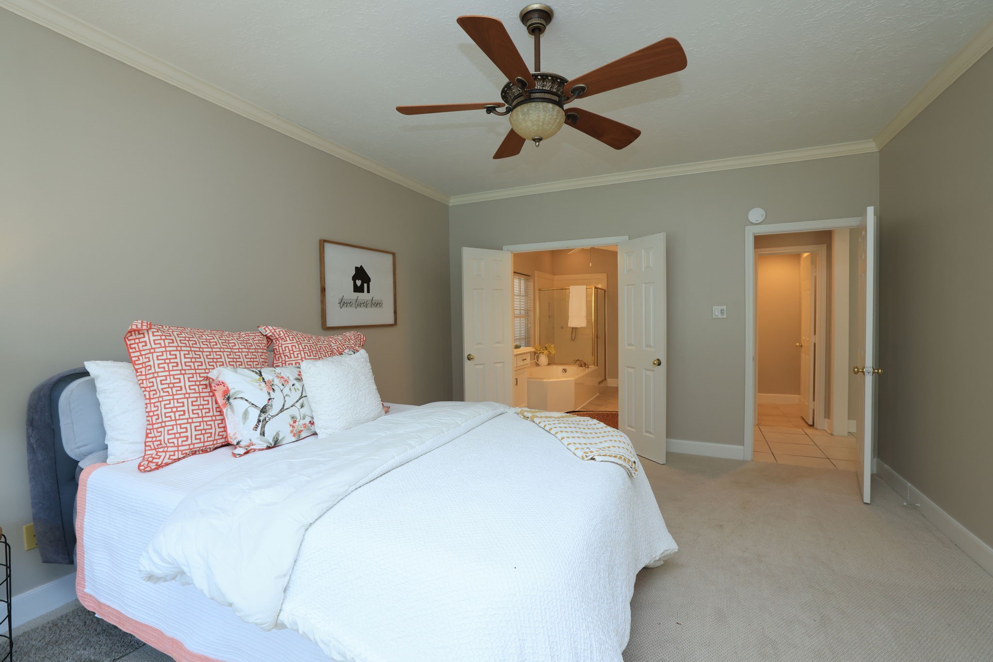 Spacious layout with double-door entry to the ensuite bath and neutral designer palette throughout.