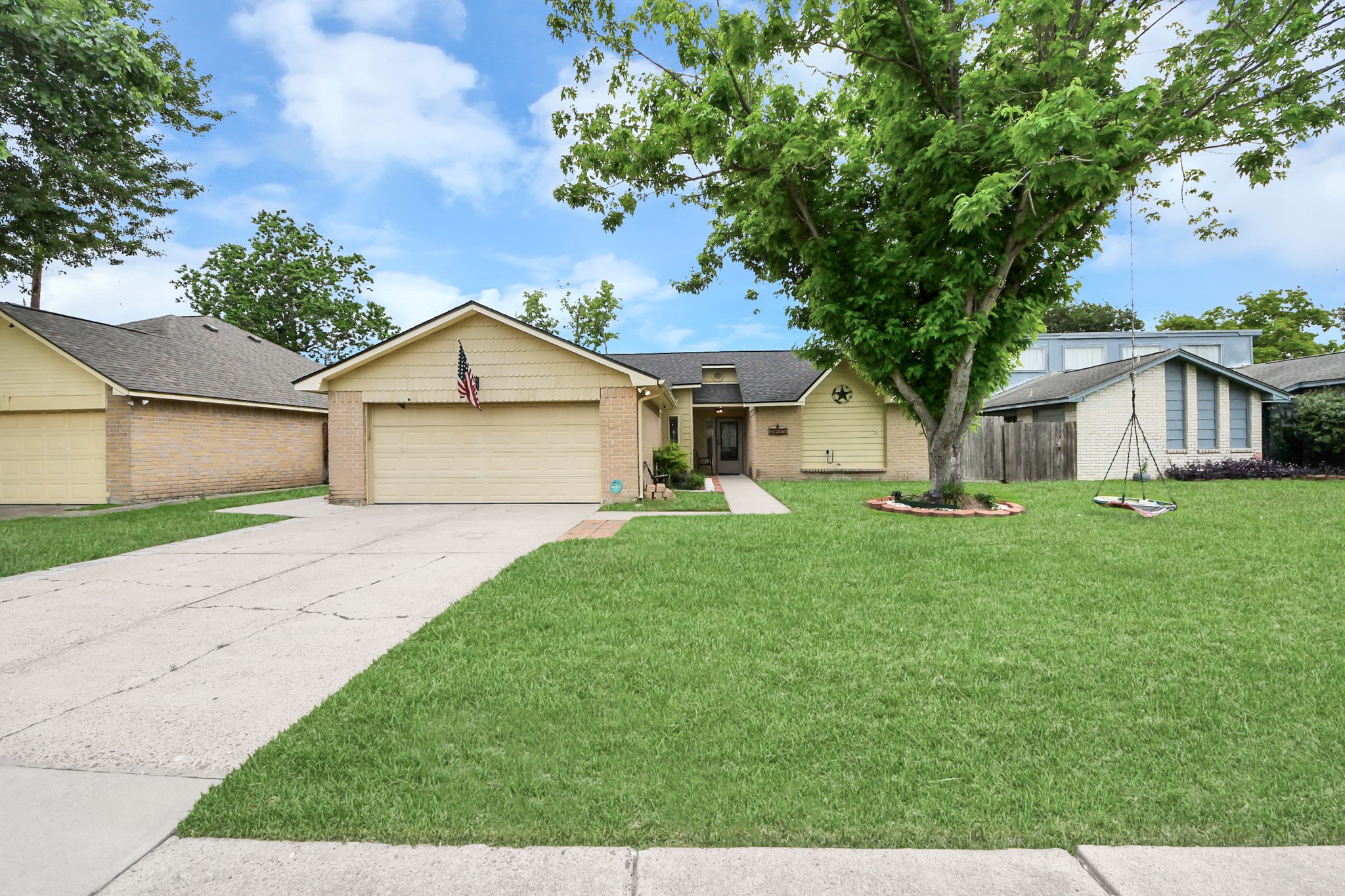 The property offers a welcoming entrance and is located in a peaceful neighborhood.