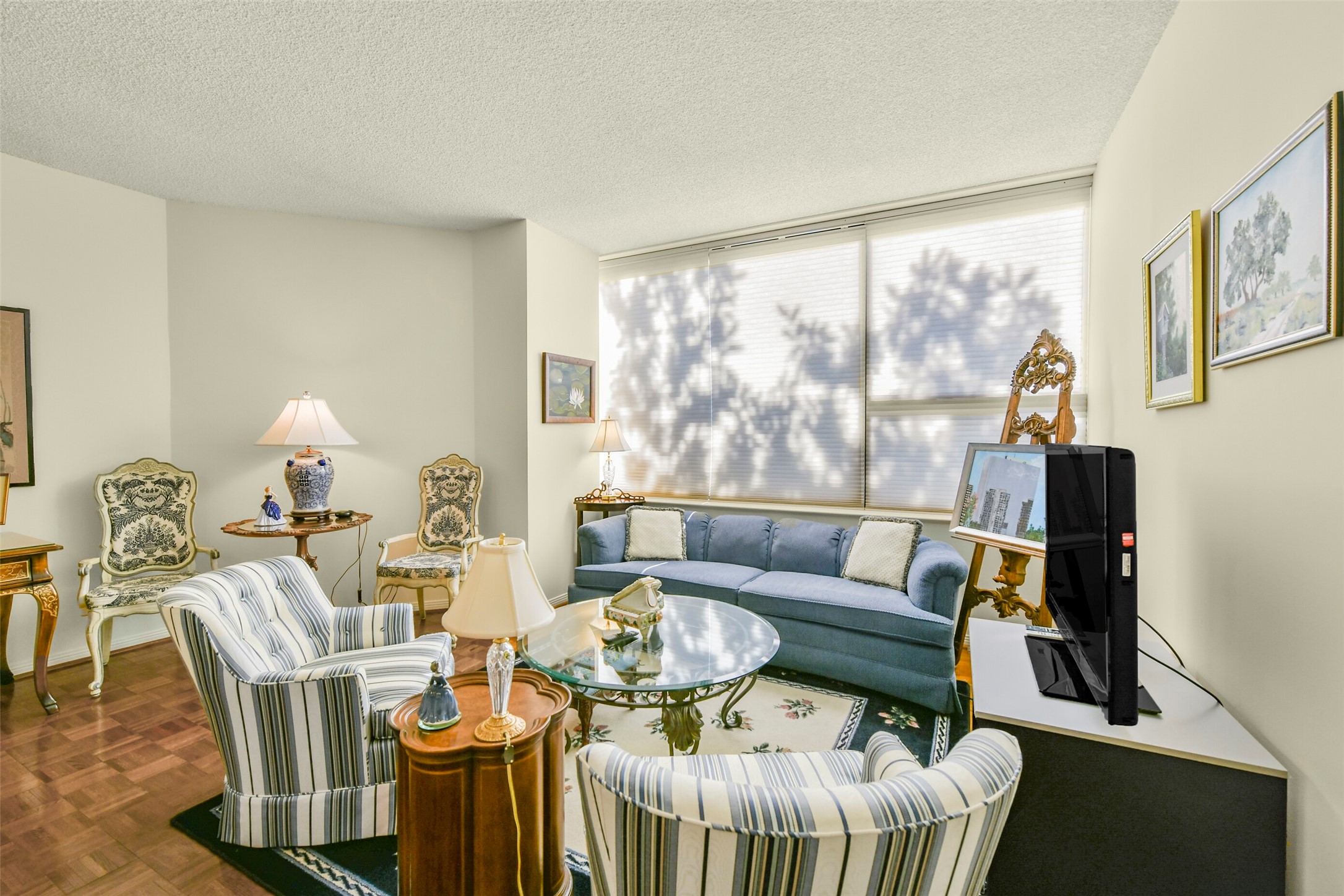Parquet floors flow throughout the living and dining area. Parquet floors flow throughout the living and dining area.