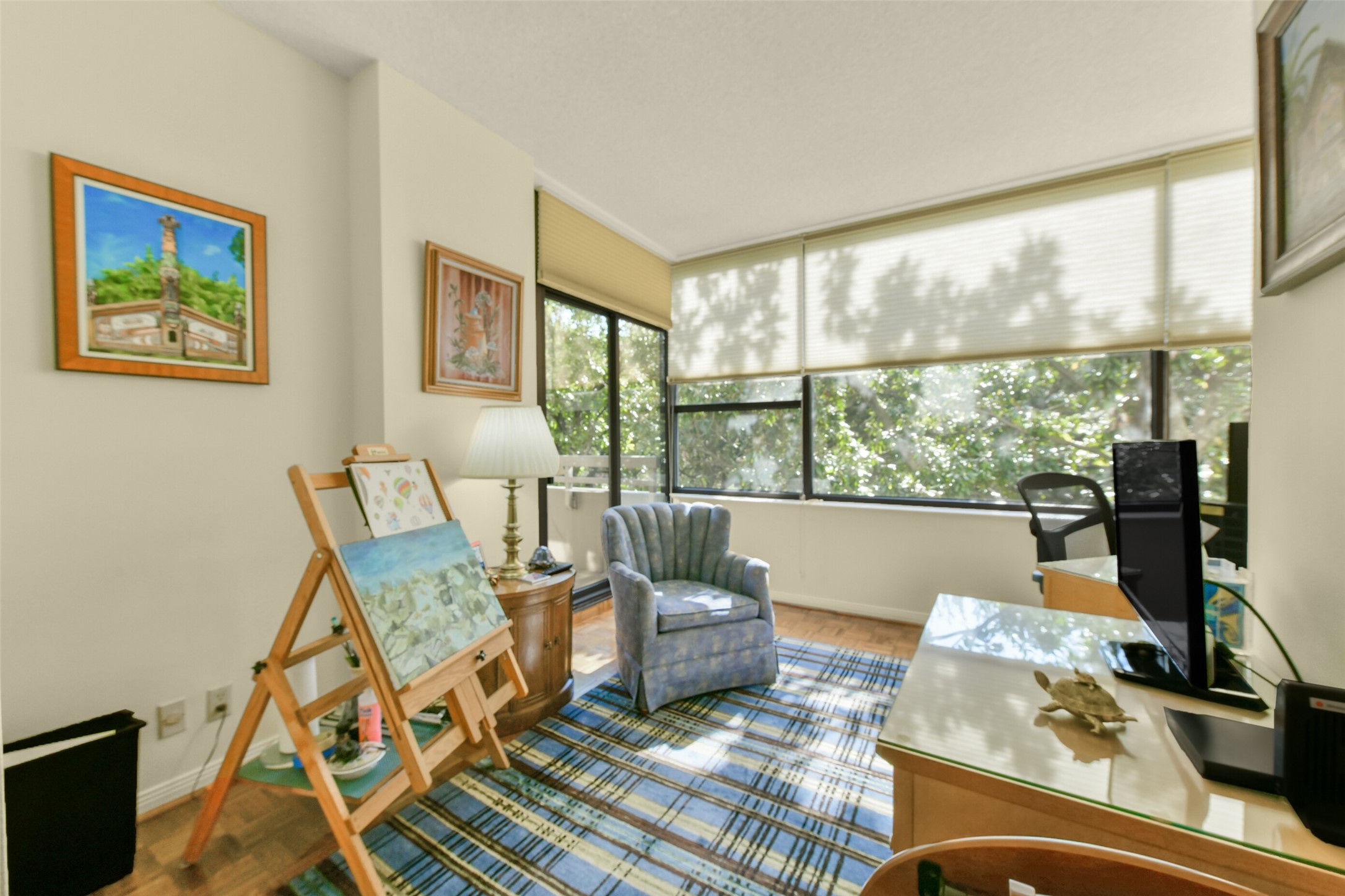 The secondary bedroom has created a tranquil art studio and study.