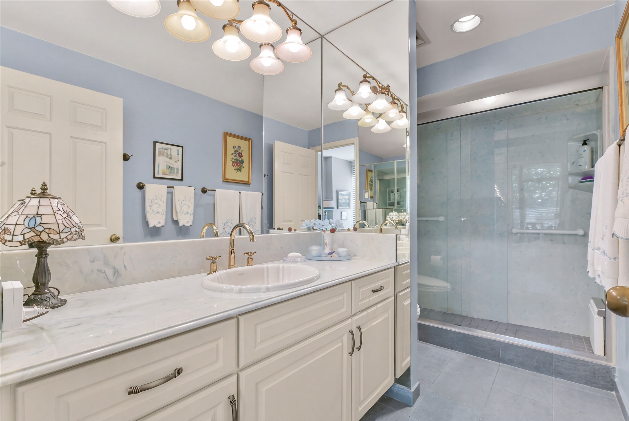 The primary ensuite bathroom features a large walk-in shower. The primary ensuite bathroom features a large walk-in shower.