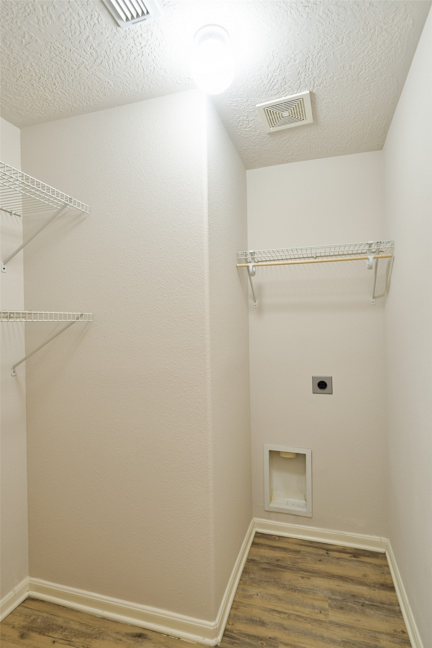 Utility room in the home in the hallway by the two secondary bedrooms.