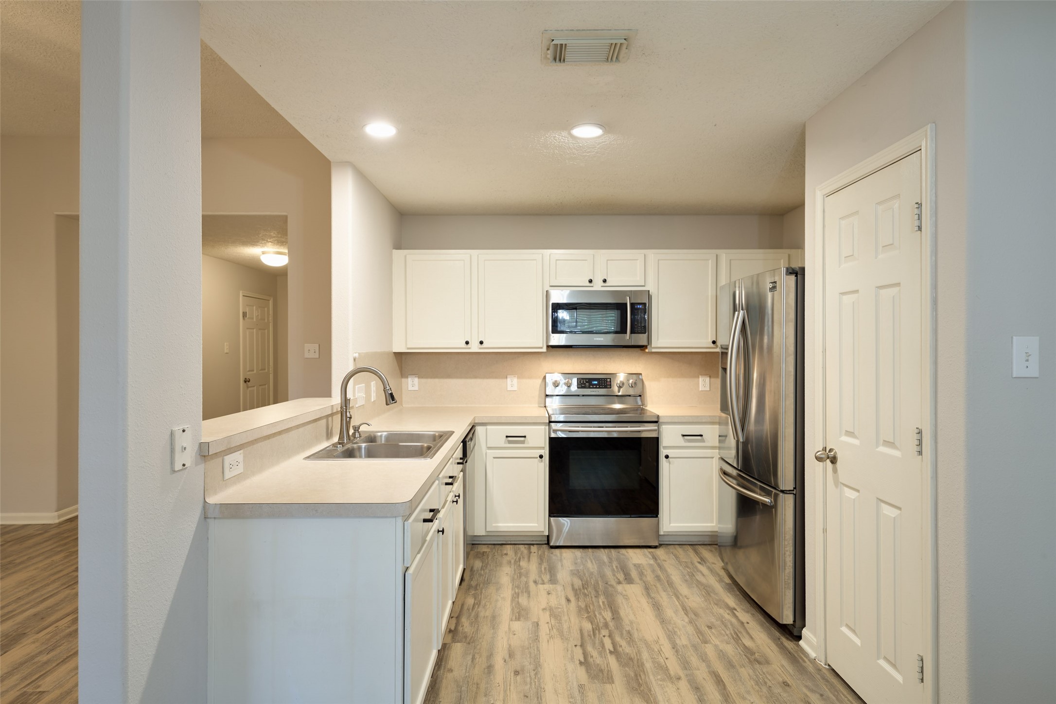 Functional kitchen - refrigerator with ice maker and water dispenser included!
