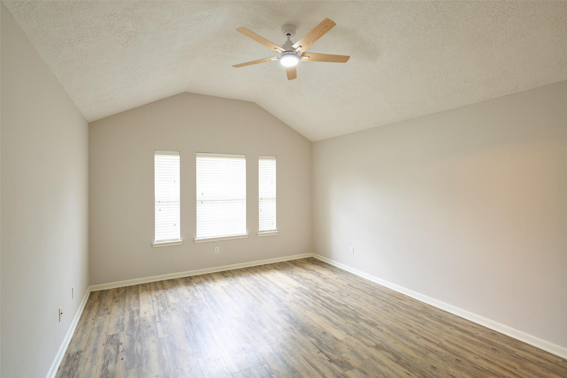 Primary bedroom with natural light and blinds for privacy. Primary bedroom with natural light and blinds for privacy.