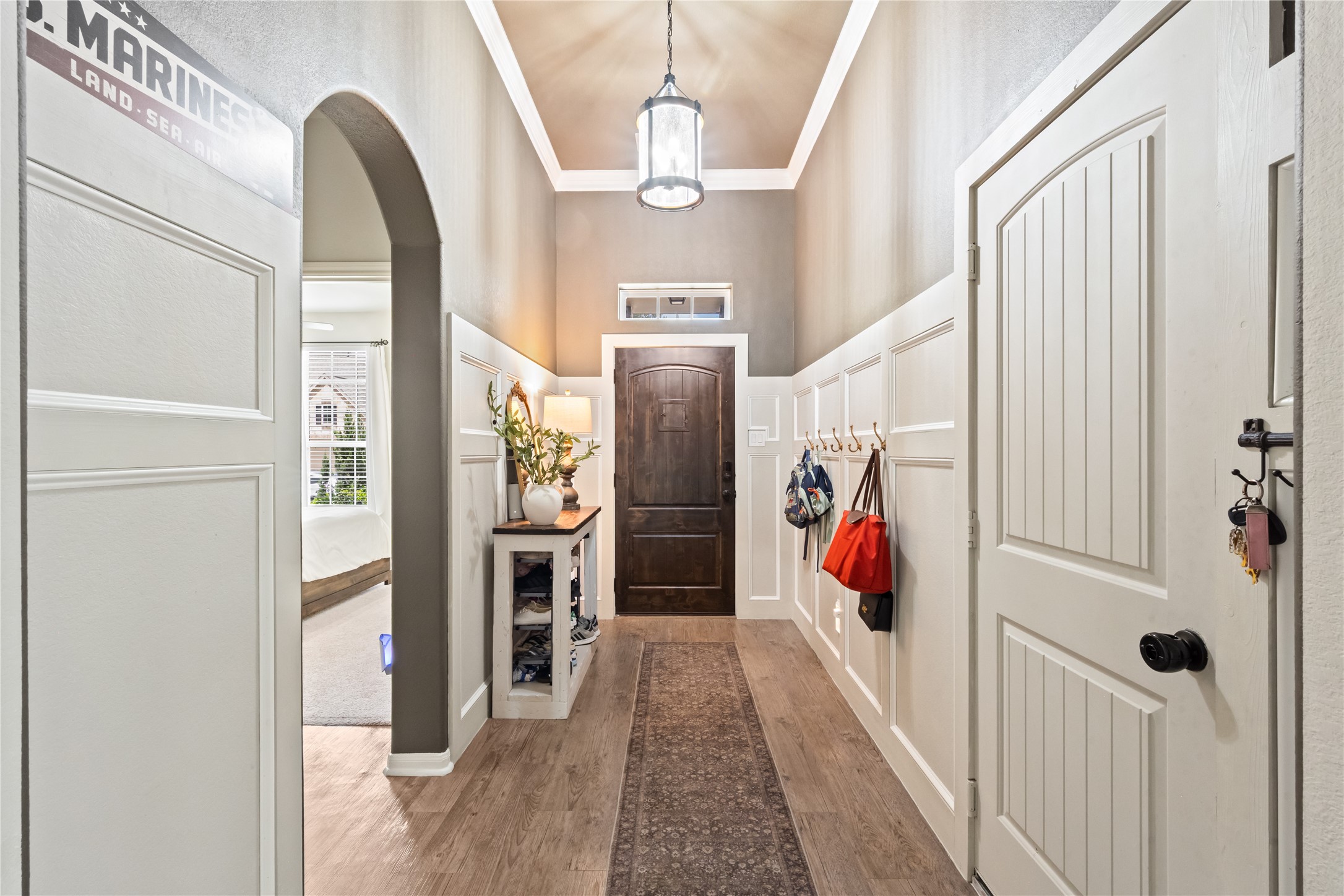 This breathtaking entryway features upgraded accent walls complete with convenient hooks for hanging your belongings. This breathtaking entryway features upgraded accent walls complete with convenient hooks for hanging your belongings.