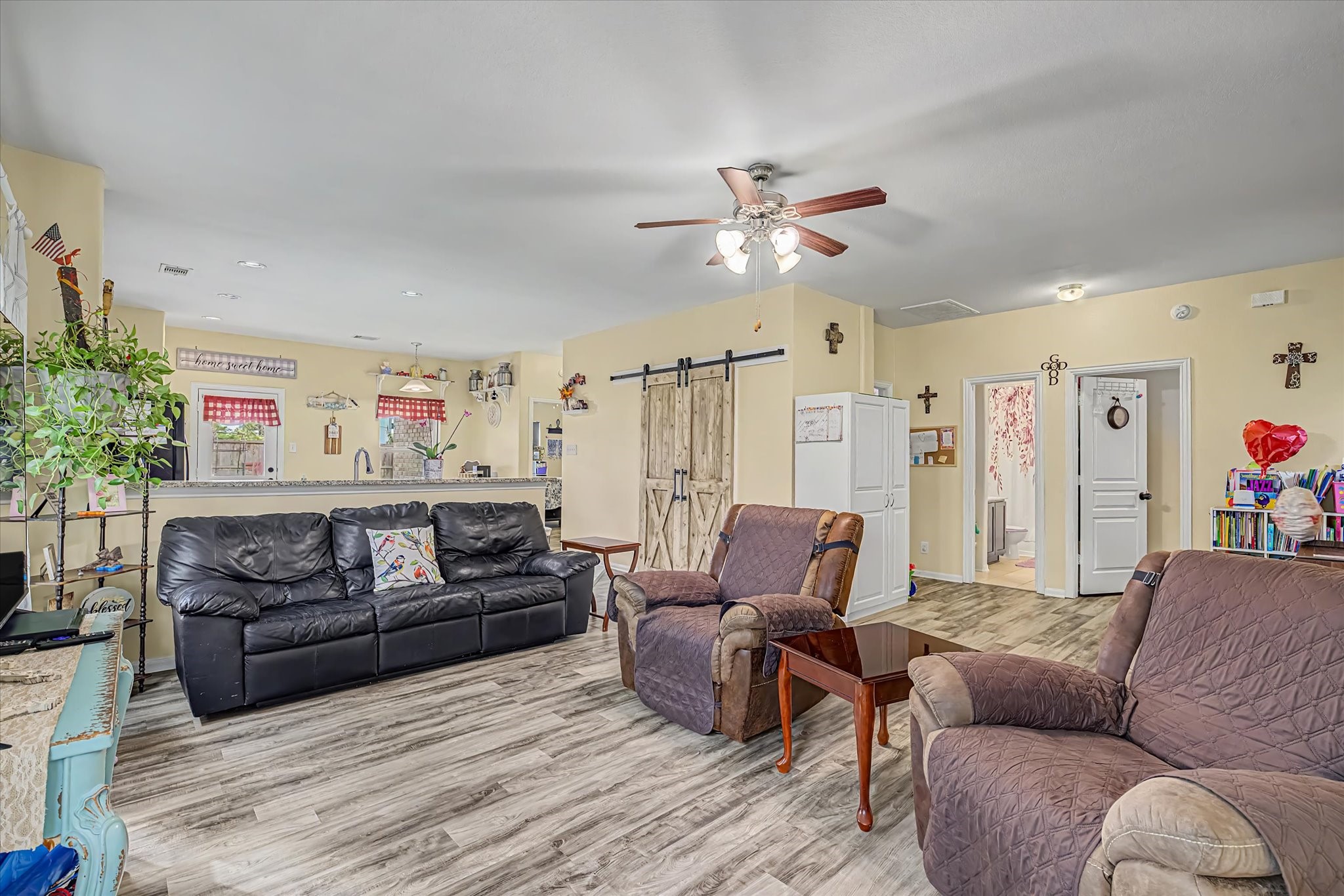 The living room offers upgraded flooring and tons of natural light. The living room offers upgraded flooring and tons of natural light.