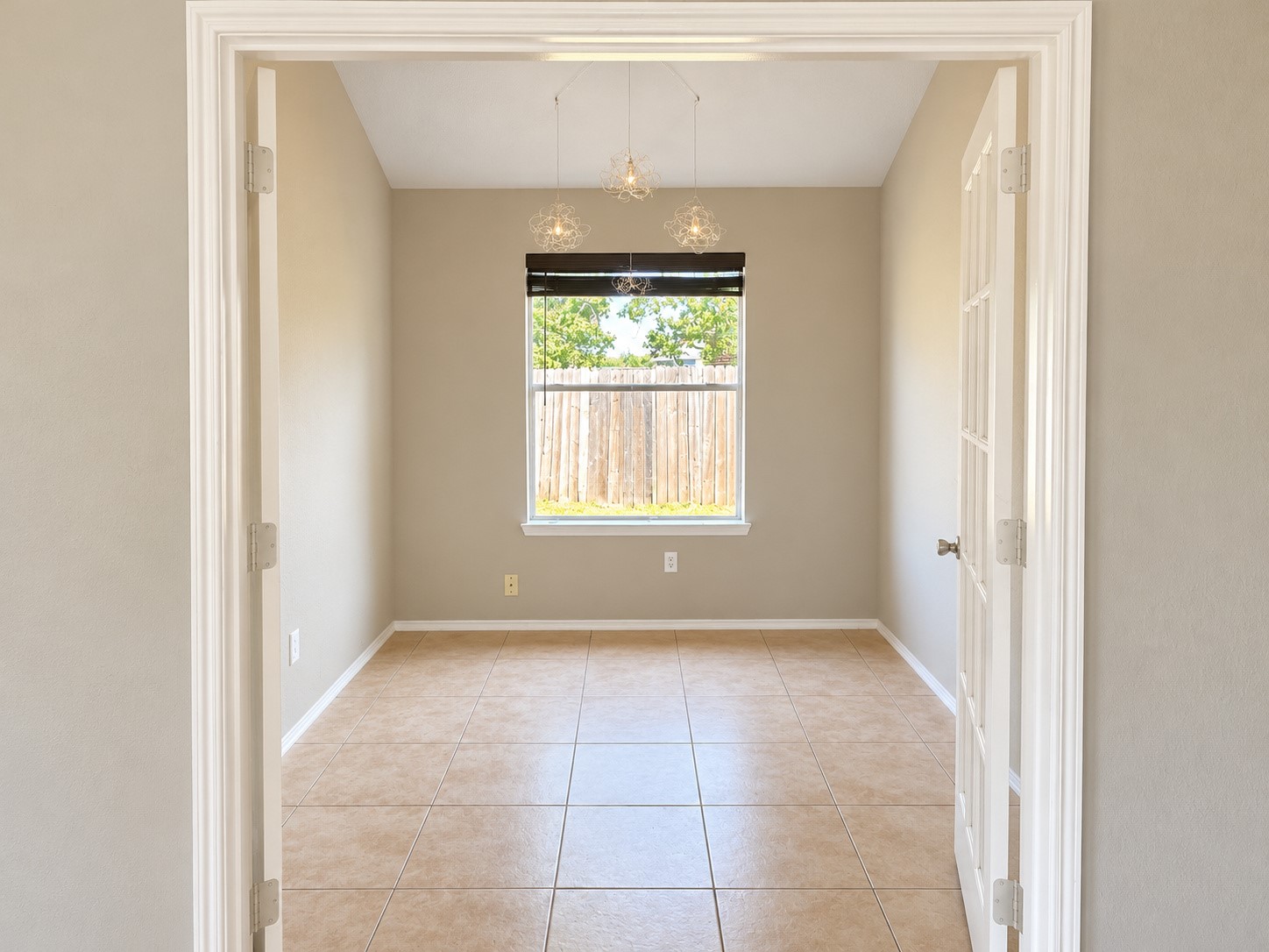 Office with French doors completely open. Office with French doors completely open.