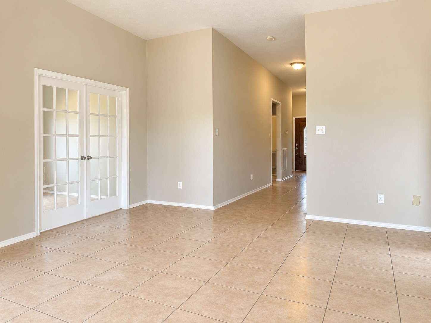 Looking back from family room with dedicated office entry on the left. Looking back from family room with dedicated office entry on the left.