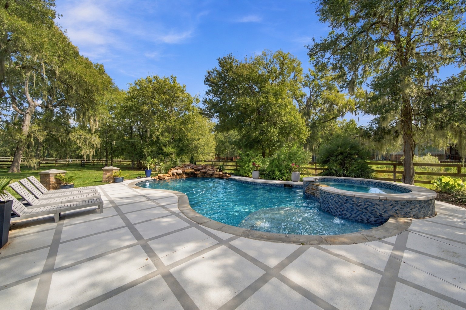 A sparkling pool and spa complete the backyard retreat, creating an inviting setting for sunny afternoons and relaxing evenings.