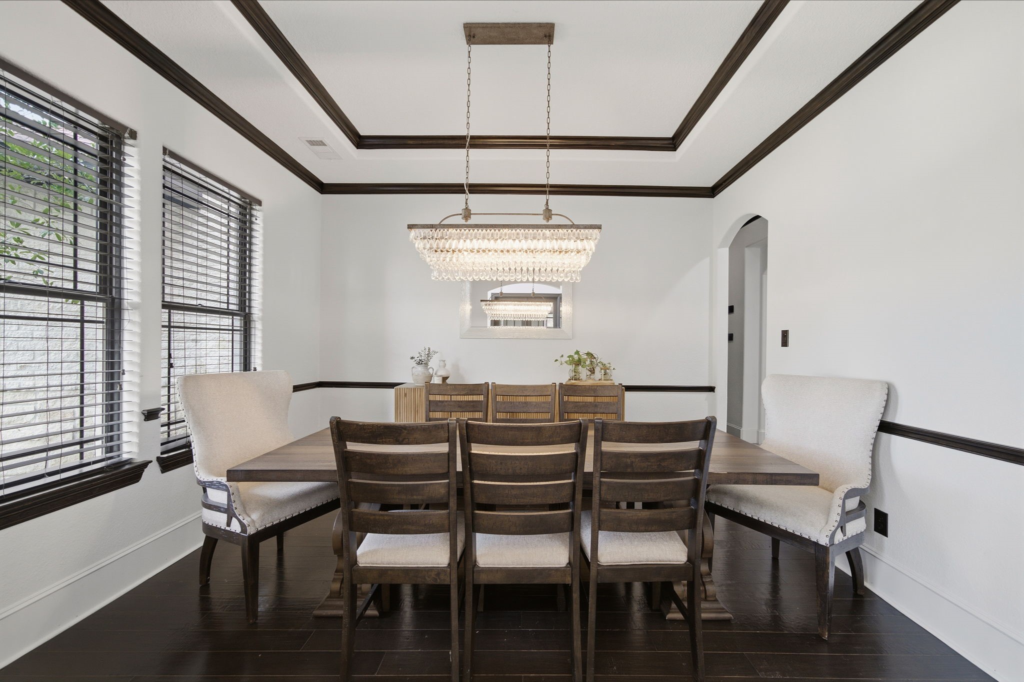 An elegant formal dining room provides a beautiful setting for holiday celebrations, dinner parties, and everyday gatherings.