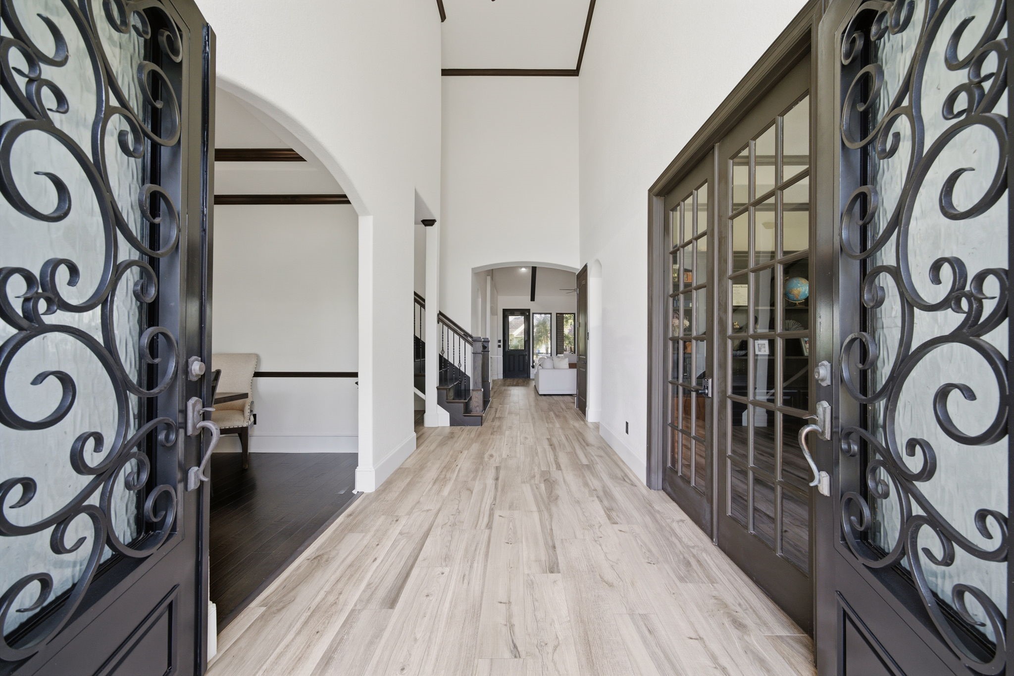 Soaring ceilings, beautiful finishes, and striking architectural details create a welcoming first impression.