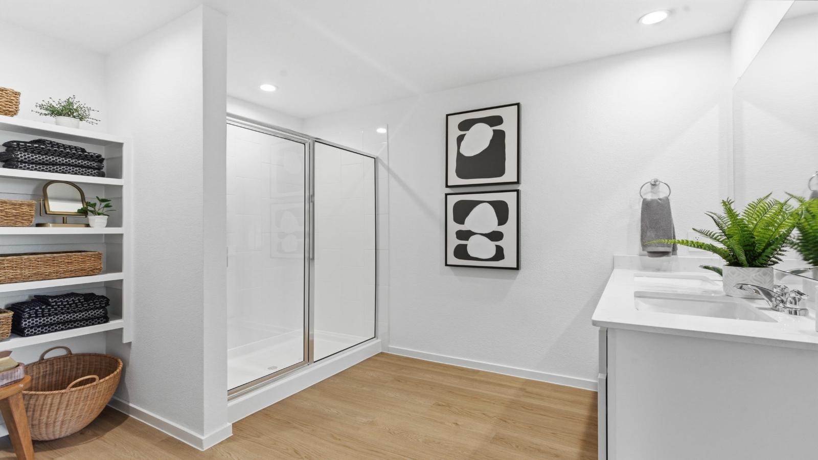 Primary bathroom with a glass-enclosed standing shower and separate soaking tub.
