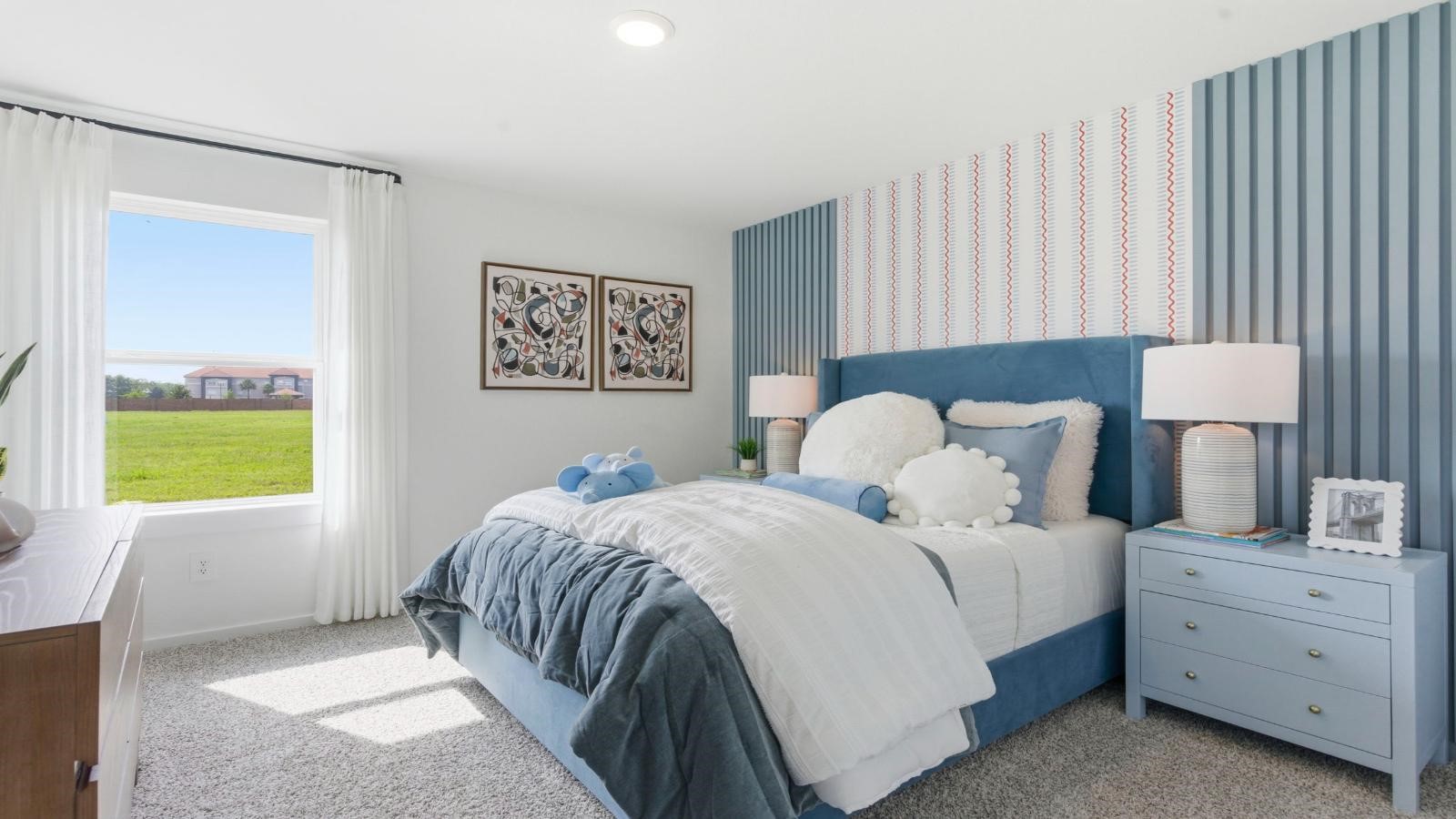 Comfortable guest bedroom featuring neutral-toned walls, carpeted flooring, and a separate closet. Comfortable guest bedroom featuring neutral-toned walls, carpeted flooring, and a separate closet.