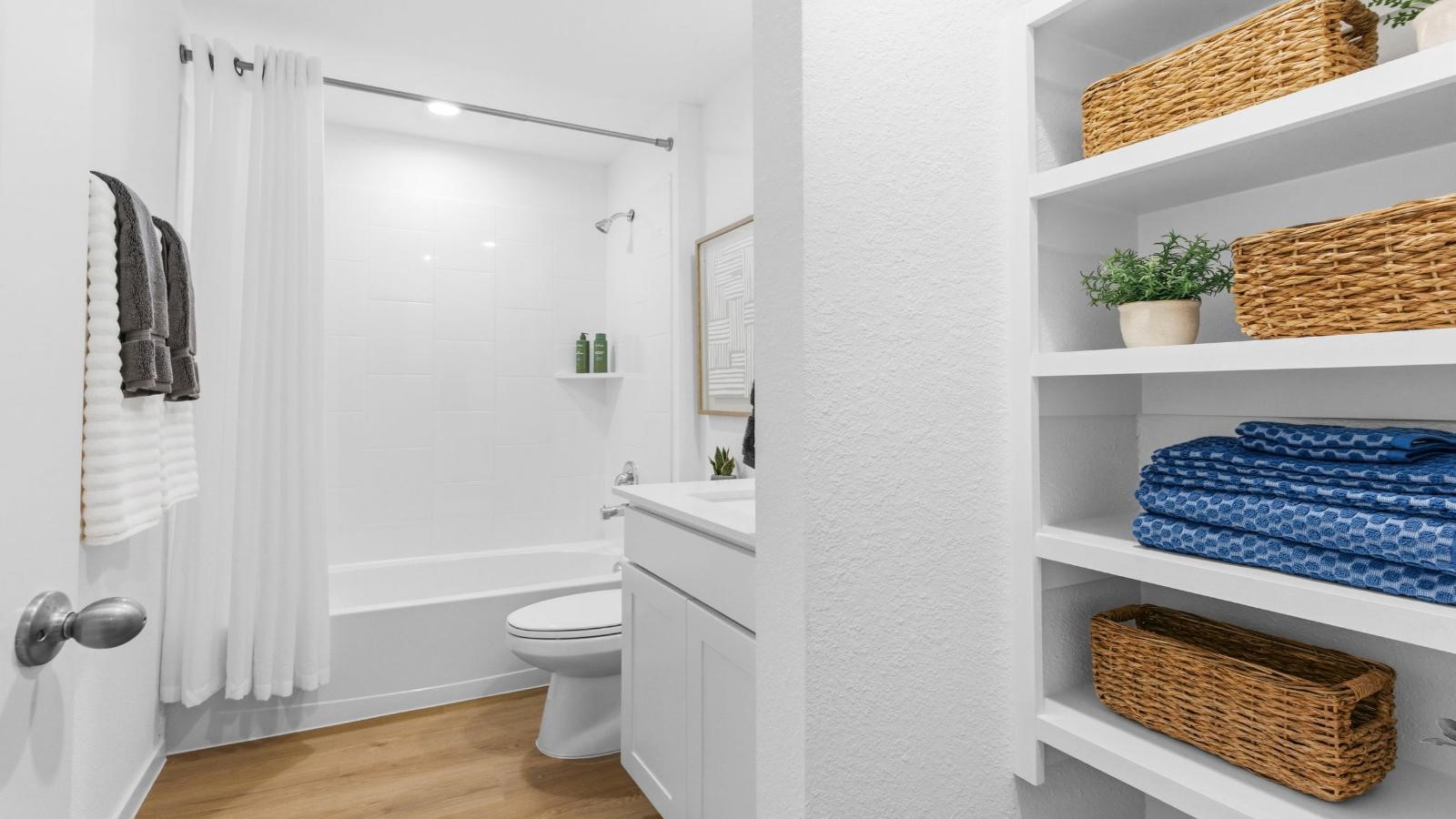 A well-designed bathroom equipped with quartz countertops, a standing tub, and a single vanity. A well-designed bathroom equipped with quartz countertops, a standing tub, and a single vanity.
