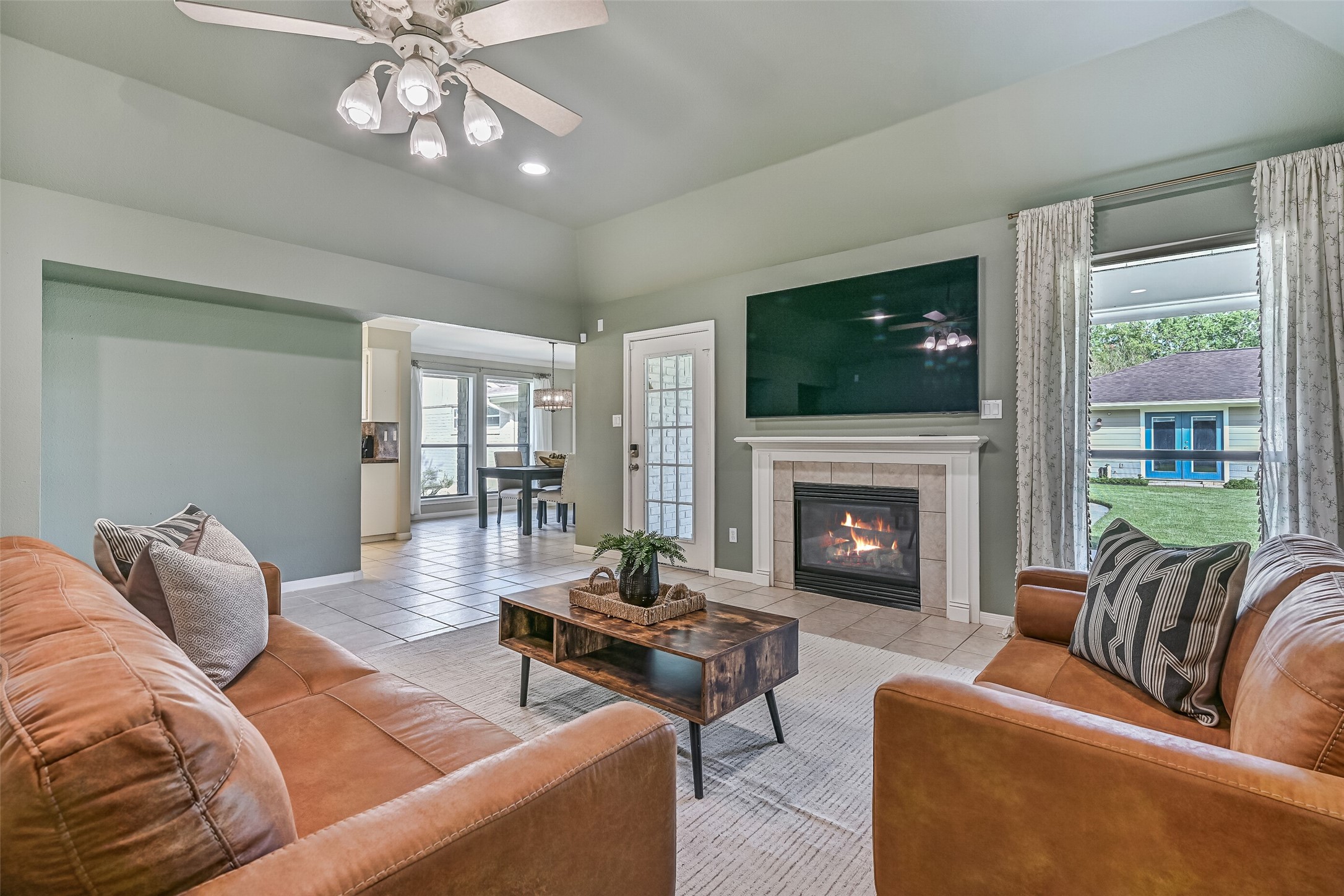 Living Area  Second Residence:
The open living area with a vaulted ceiling, recessed lighting, and a lighted ceiling fan, makes a seamless transition into the dining area and kitchen. The step-free layout enhances ease of movement while maintaining clear sightlines.