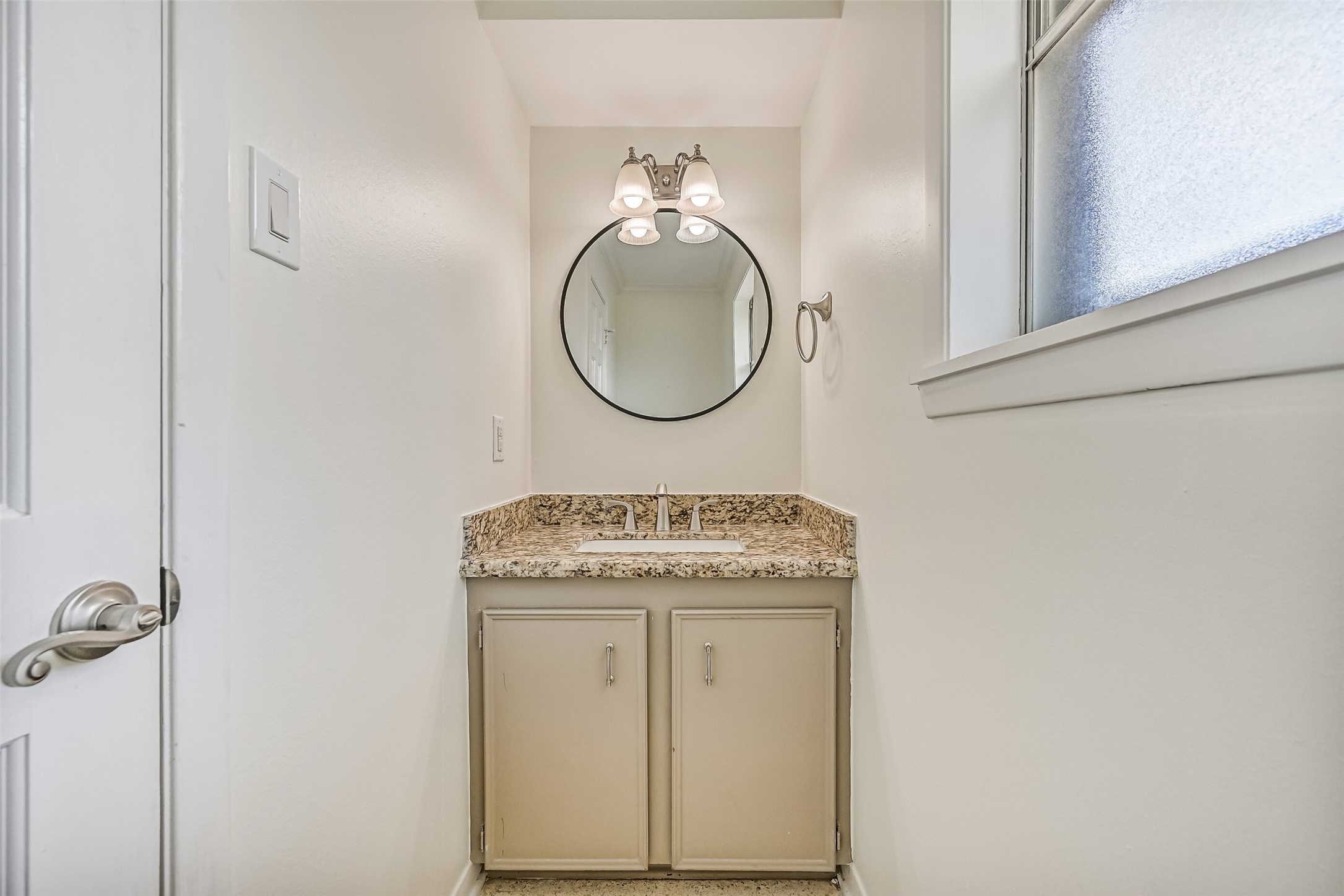 Mudroom & Half Bath  First Residence:
Just inside the rear entry and off of the kitchen, this well-designed mudroom offers built-in cabinetry and ample storage, creating an ideal drop zone with convenient access, as well as a half bathroom.