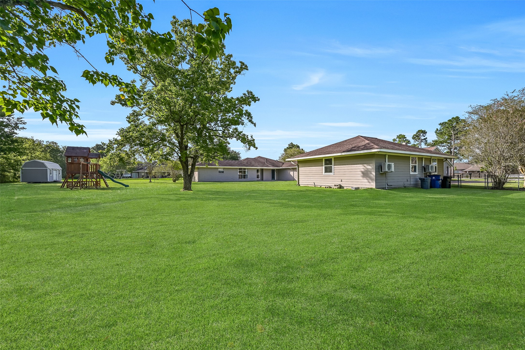 Backyard Overview:
An expansive, park-like backyard showcases wide open green space dotted with mature trees & an included playset and storage shed. This property offers privacy, flexibility, and 1.3 acres of room to roam, without the limitations of a HOA! Dream Big!