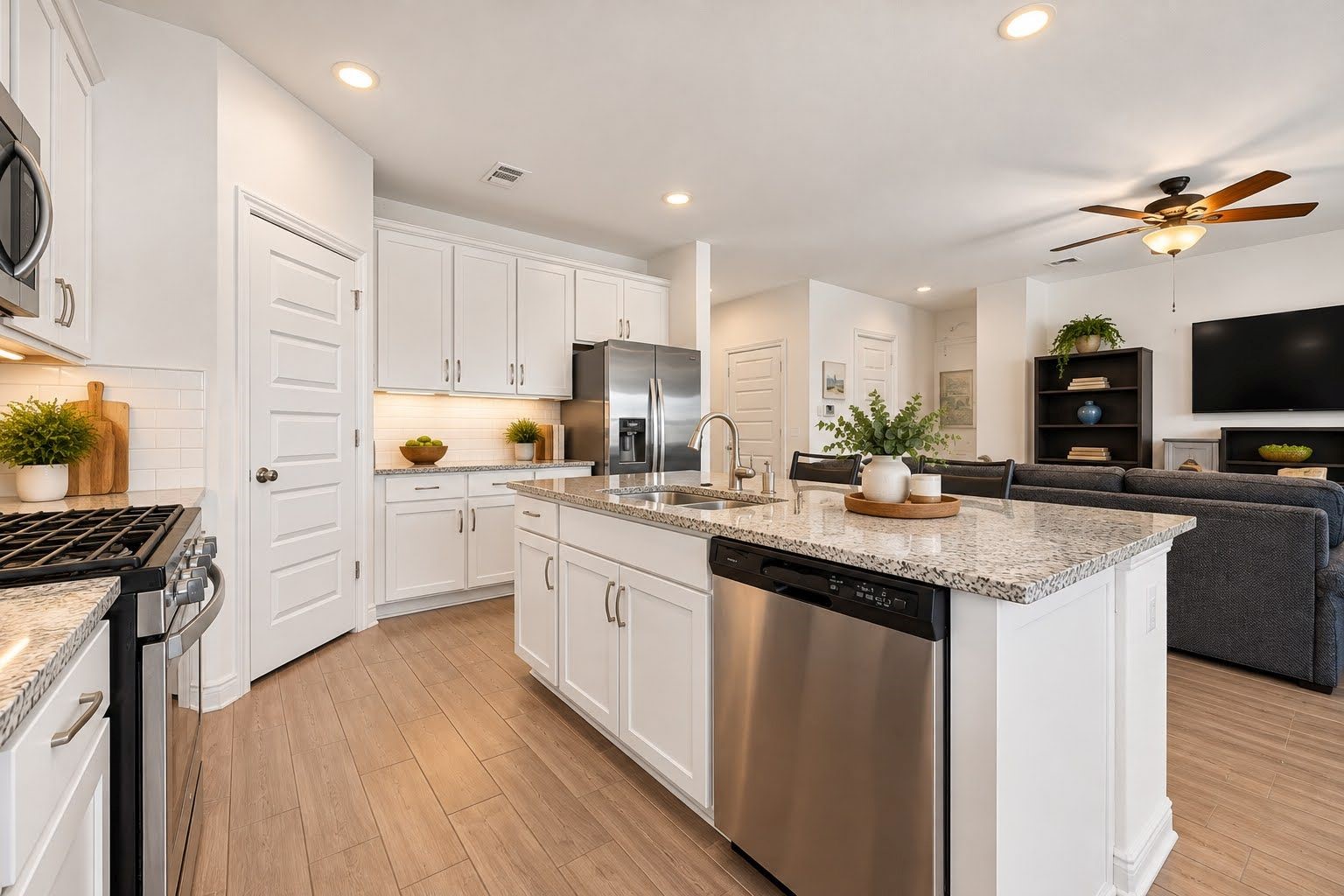 Kitchen is open to family room for an open, airy feel, and perfect for entertaining. Kitchen is open to family room for an open, airy feel, and perfect for entertaining.