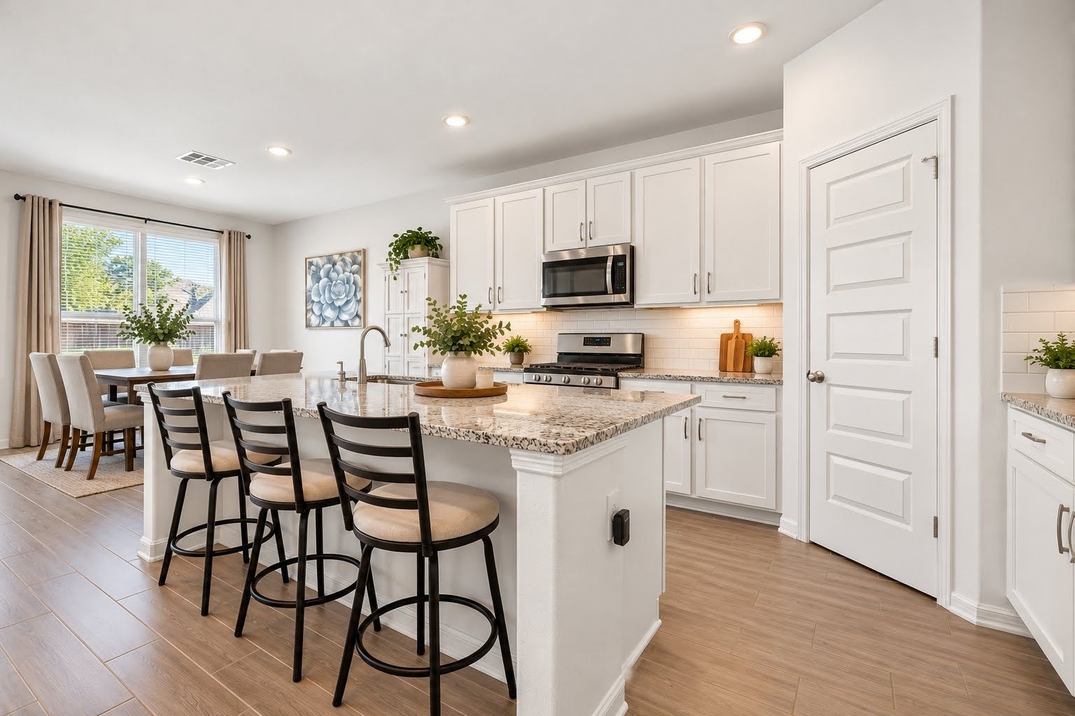 Large breakfast area, and room for 3 barstools at breakfast bar. Large breakfast area, and room for 3 barstools at breakfast bar.