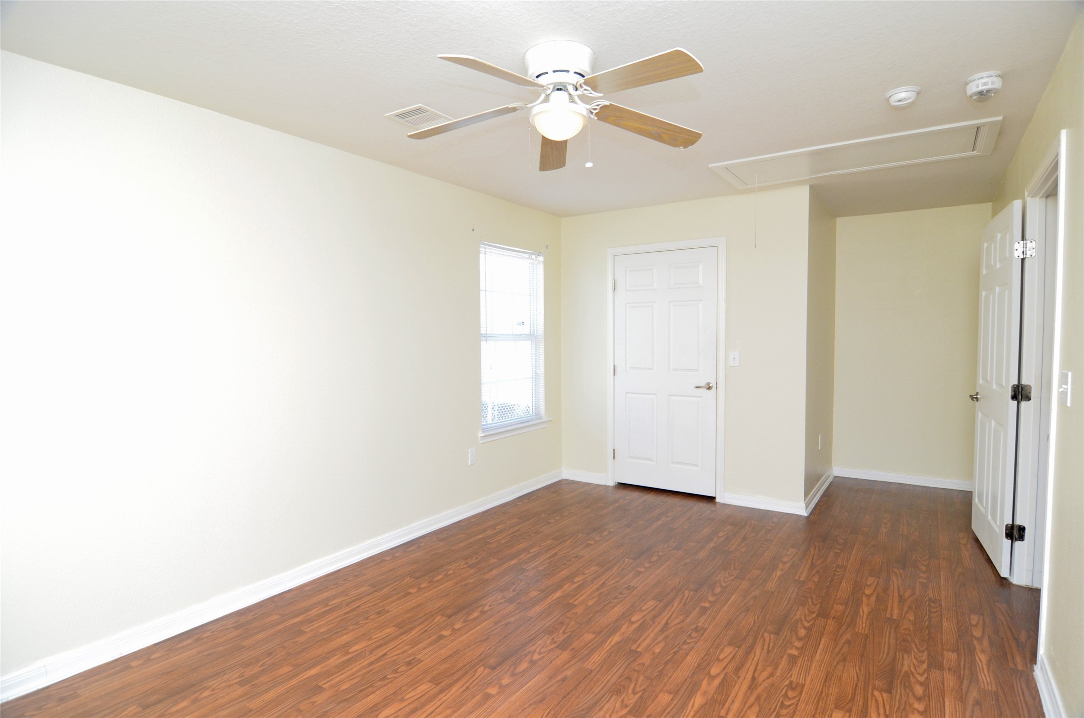 Primary bedroom with walk-in closet