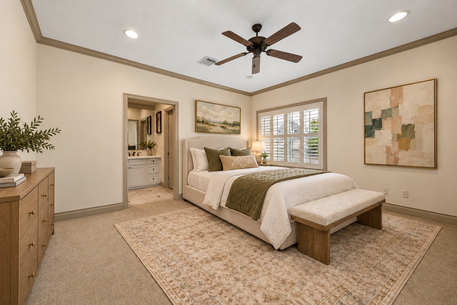 Spacious 2nd floor secondary bedroom #1  featuring windows w/ plantation shutters, crown molding, recessed lighting, ceiling fan & carpet. Enjoys access to Jack & Jill bath w/ its own private vanity area & walk-in closet w/ built-in hanging & shelving, providing wonderful storage & functionality. Virtually staged.