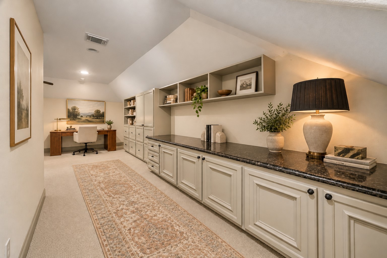 A look at the 3rd floor highlighting wonderful built-in shelving & storage, perfect for displaying books, artwork & decorative pieces. This additional level offers excellent flexibility w/ a spacious flex room & full bath, creating an ideal room for guests, home office, gym or media room. Virtually staged.