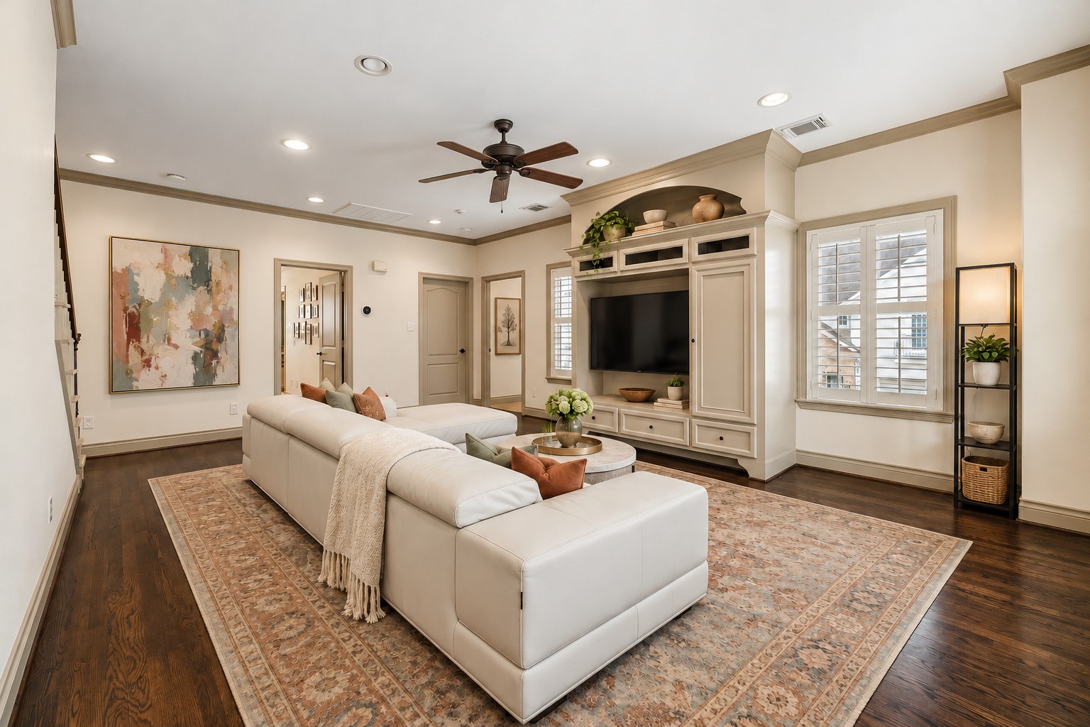 Spacious 2nd floor game room offers a wonderful additional living space featuring built-in entertainment center w/ TV enclave & storage for AV equipment. Recessed lighting, ceiling fan & generous proportions provide plenty of room for large furnishings. Flexible space lends itself beautifully to media room, playroom or additional gathering space. Virtually staged.