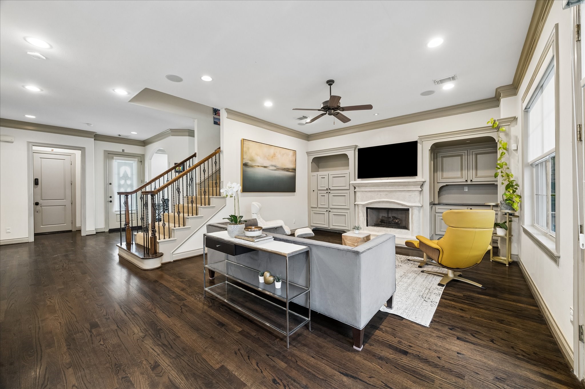 Beautiful view showcasing generous proportions of the family room & abundant natural light from rear windows & French doors. Open sightlines to the other main living spaces allowing each space to feel connected while maintaining its own distinct purpose. A wonderful gathering space w/ plenty of room for large furnishings! Virtually staged.