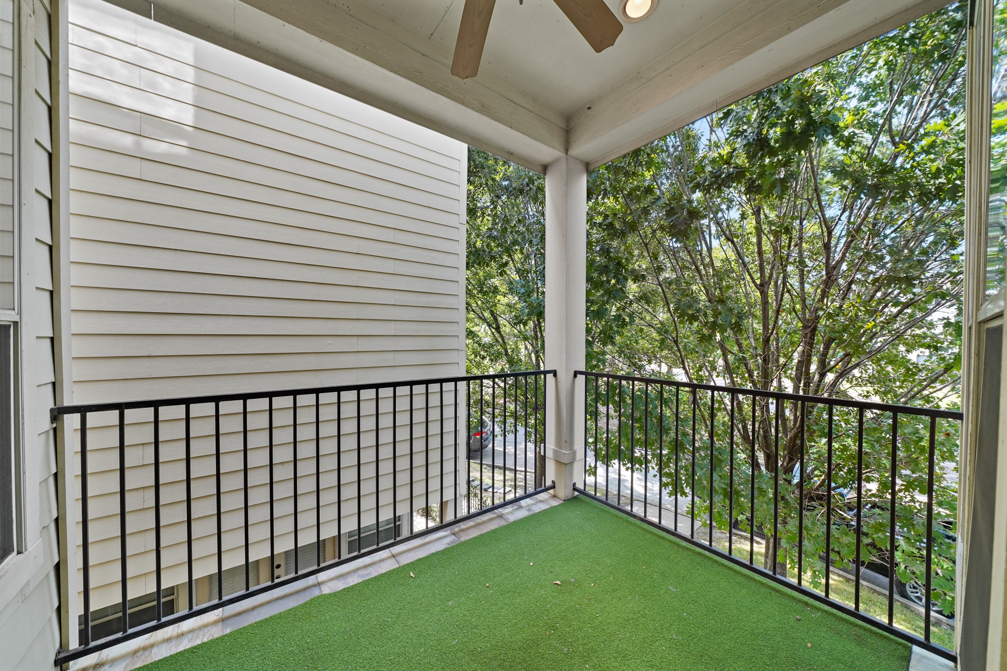 Second floor balcony just outside the living room. It also has a ceiling fan.