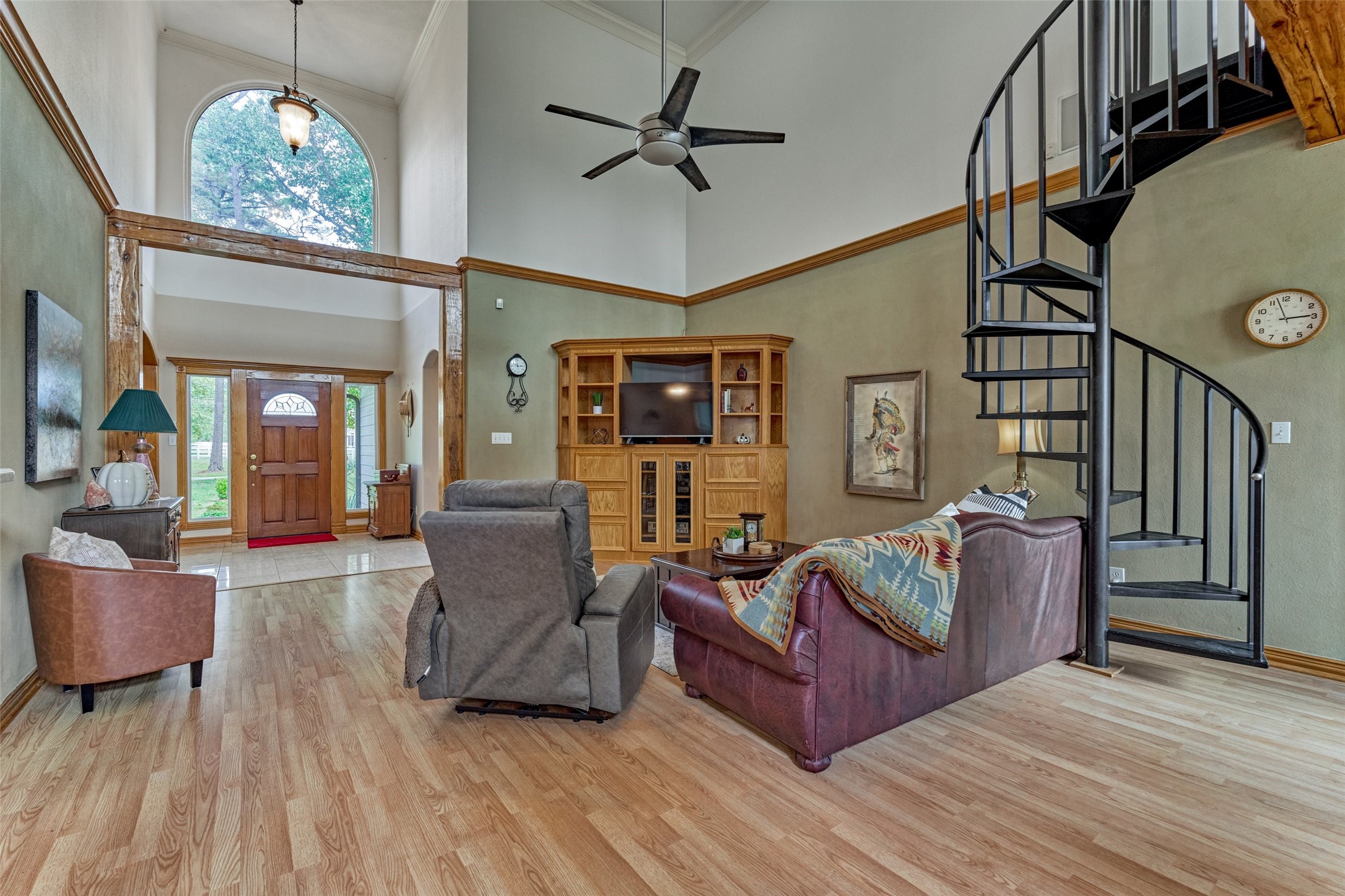 20' ceilings in in the great room, spiral staircase to upstairs landing and optional flex space. Custom built-ins.