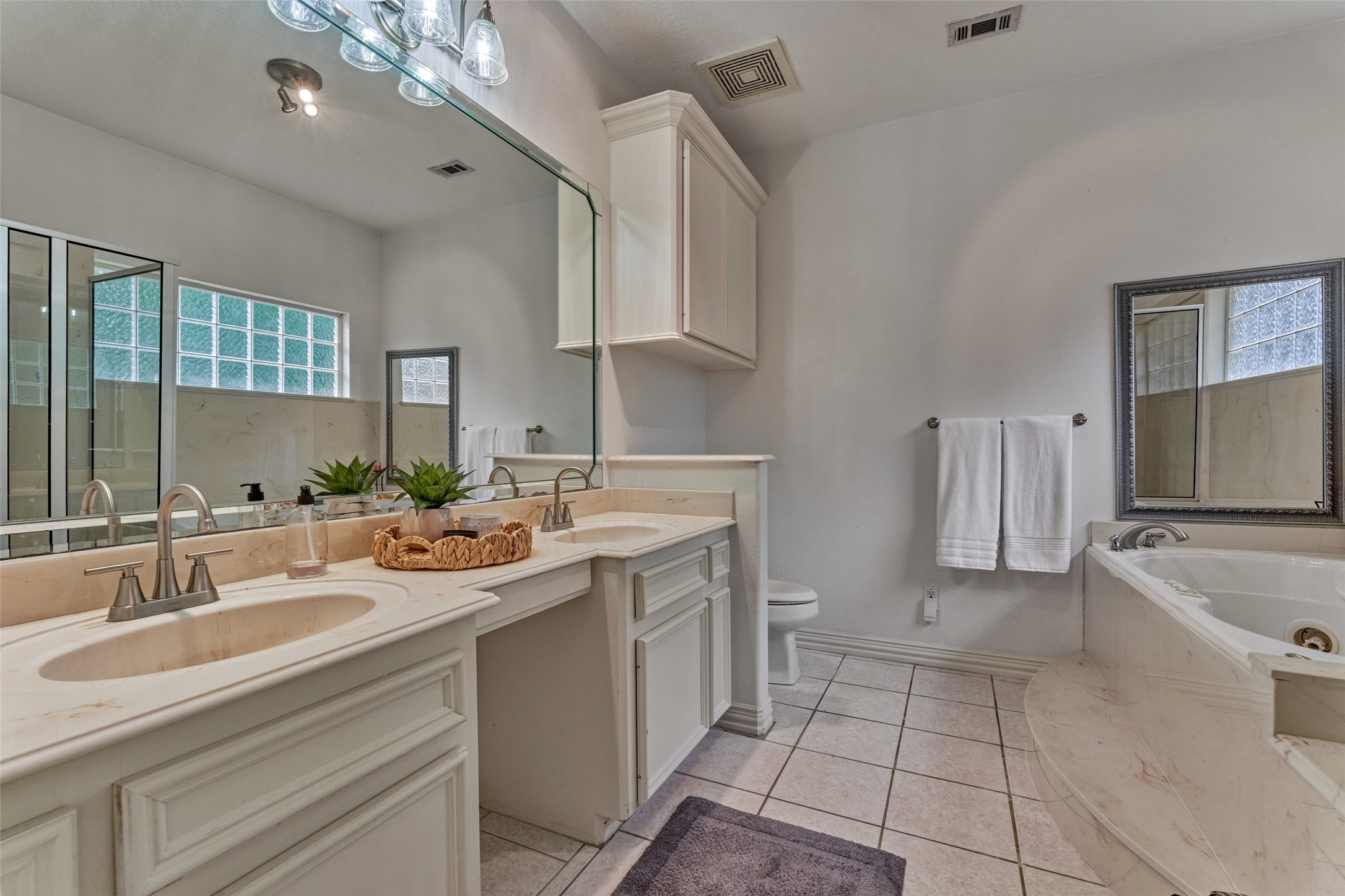 Owner's suite double sinks off of bedroom