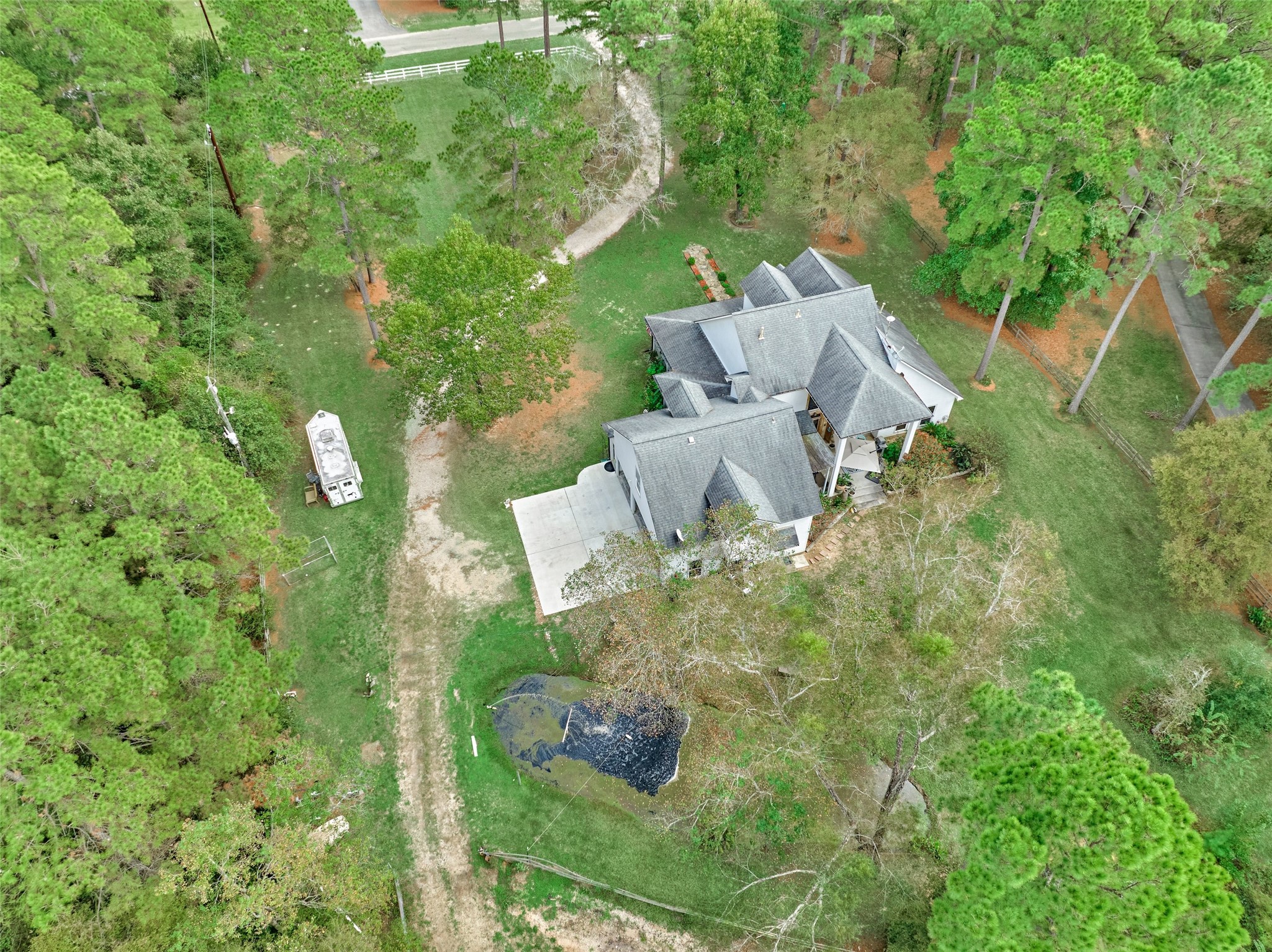 Aerial view of the home, acreage and first pond. Aerial view of the home, acreage and first pond.