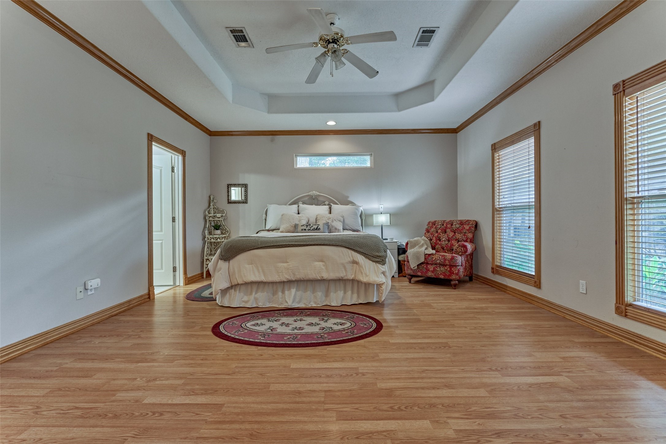 Owner's suite is separate from other bedrooms, making it a private retreat just off the main living area and overlooking the back property.