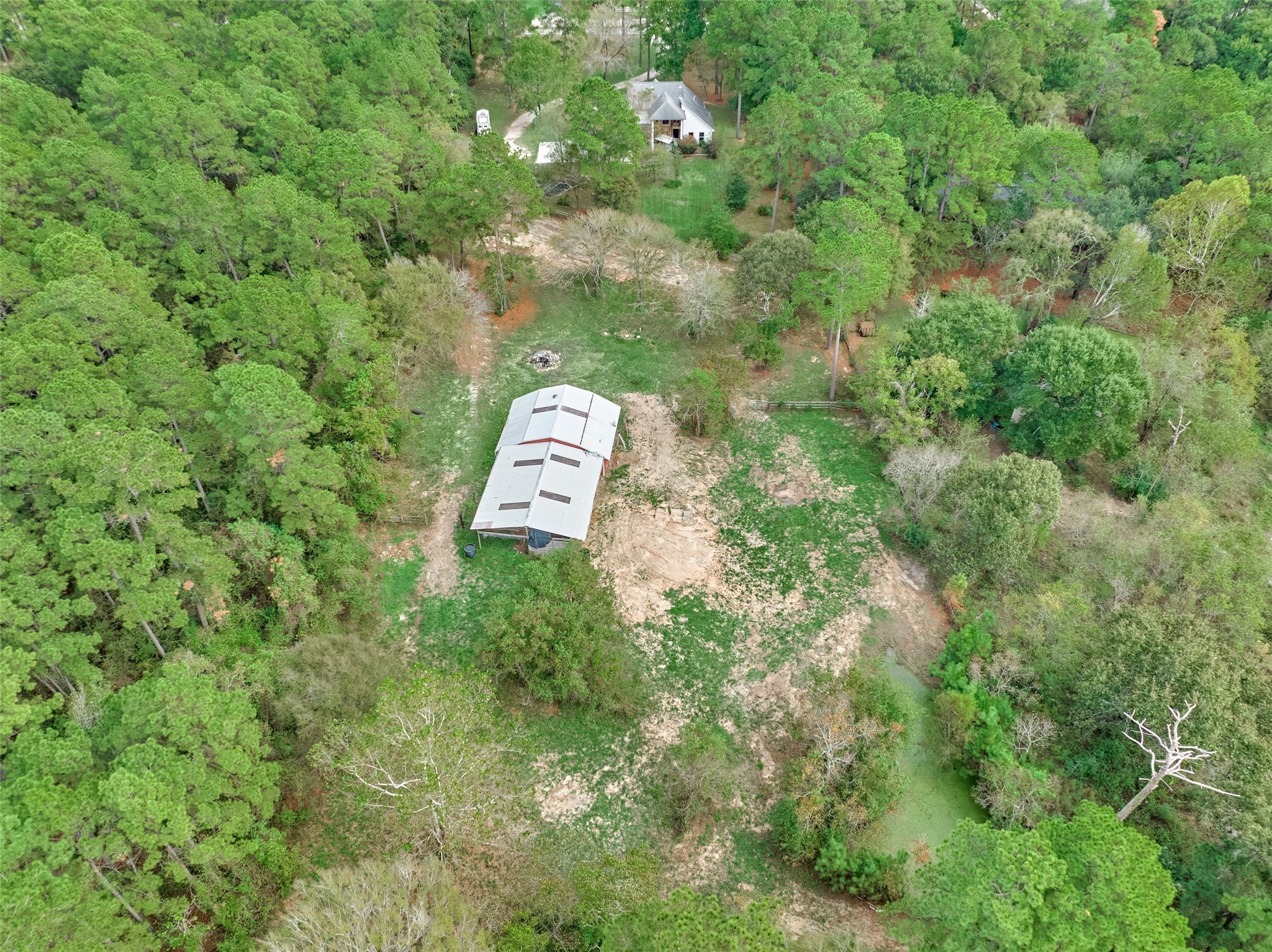 Aerial view of the barns, three acres and second pond. Aerial view of the barns, three acres and second pond.