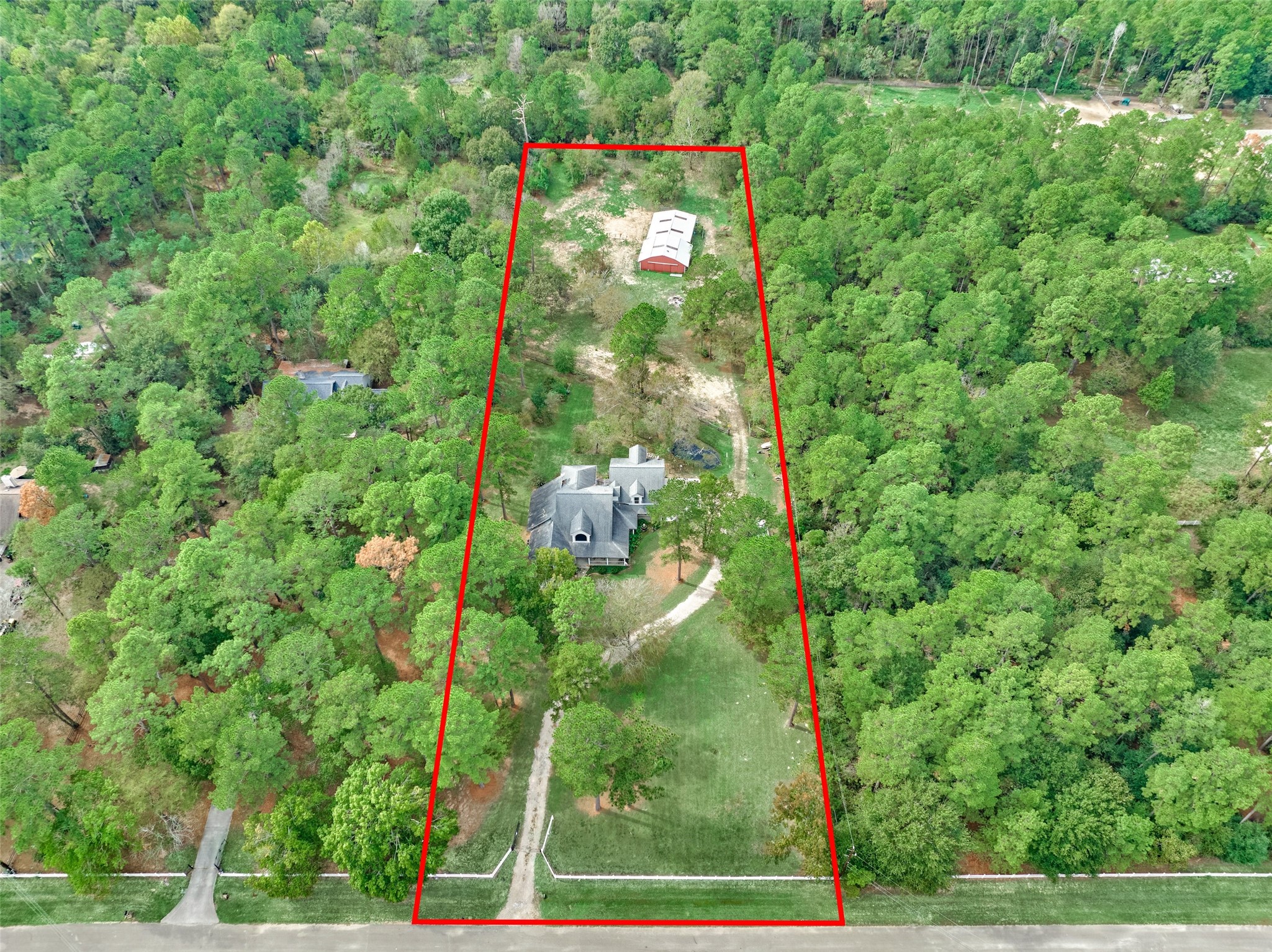 Expansive three-acre wooded property nestled within lush greenery, offering privacy and plenty of room for horses or animals, backs up to the neighborhood 7-mile equestrian trail. Expansive three-acre wooded property nestled within lush greenery, offering privacy and plenty of room for horses or animals, backs up to the neighborhood 7-mile equestrian trail.