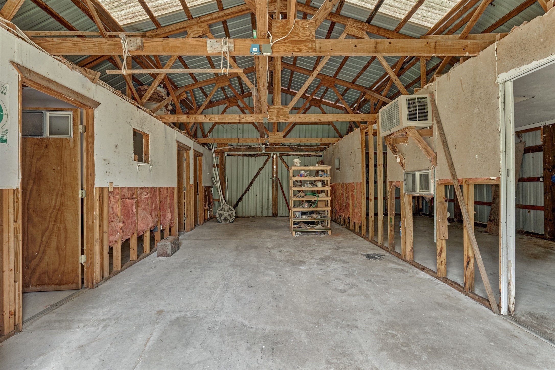 The metal pole barn has a concrete foundation and was once used as an apartment.  Now ready for your workshop or space for whatever you can imagine!