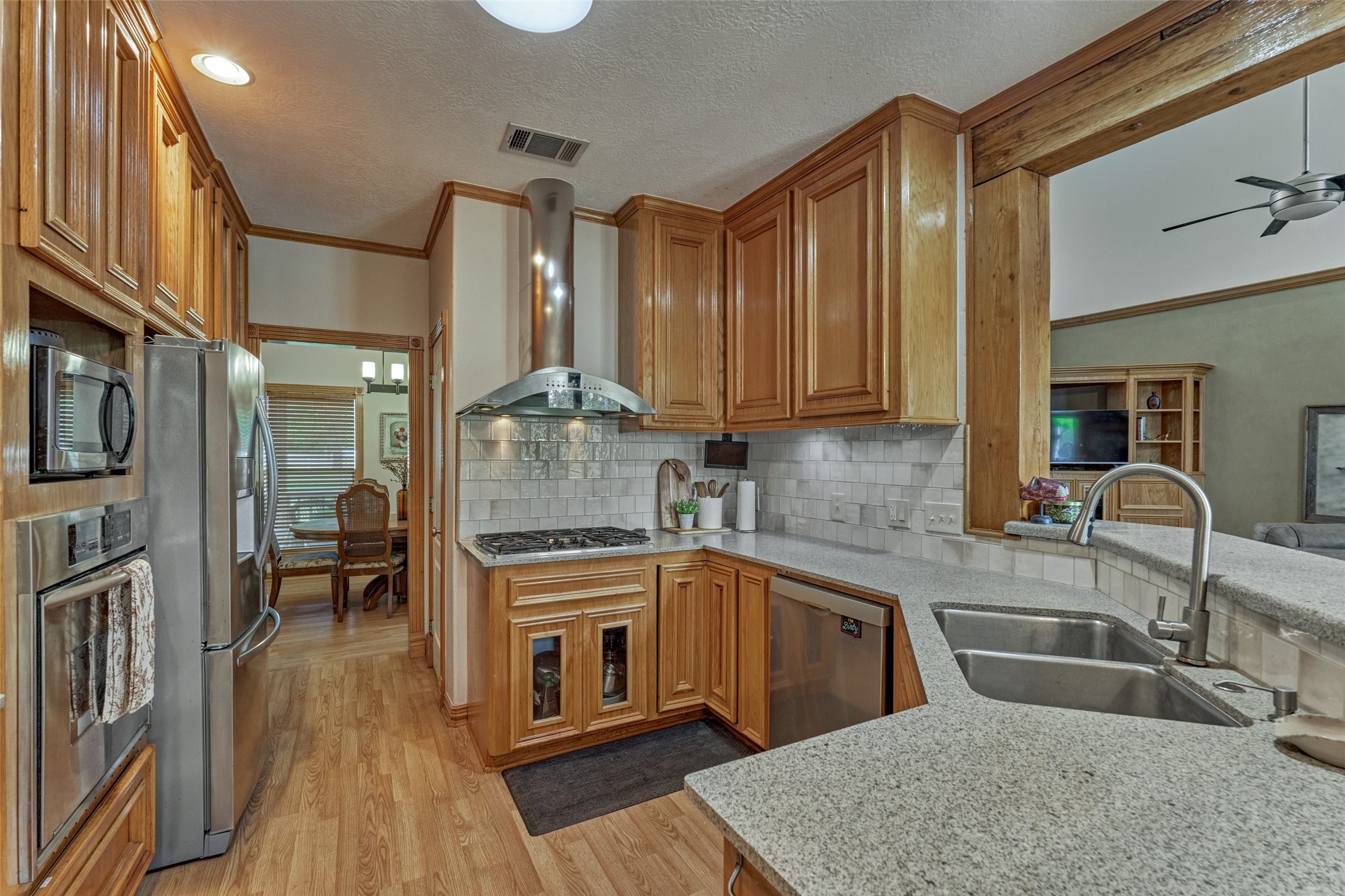Stainless appliances and stone countertops.